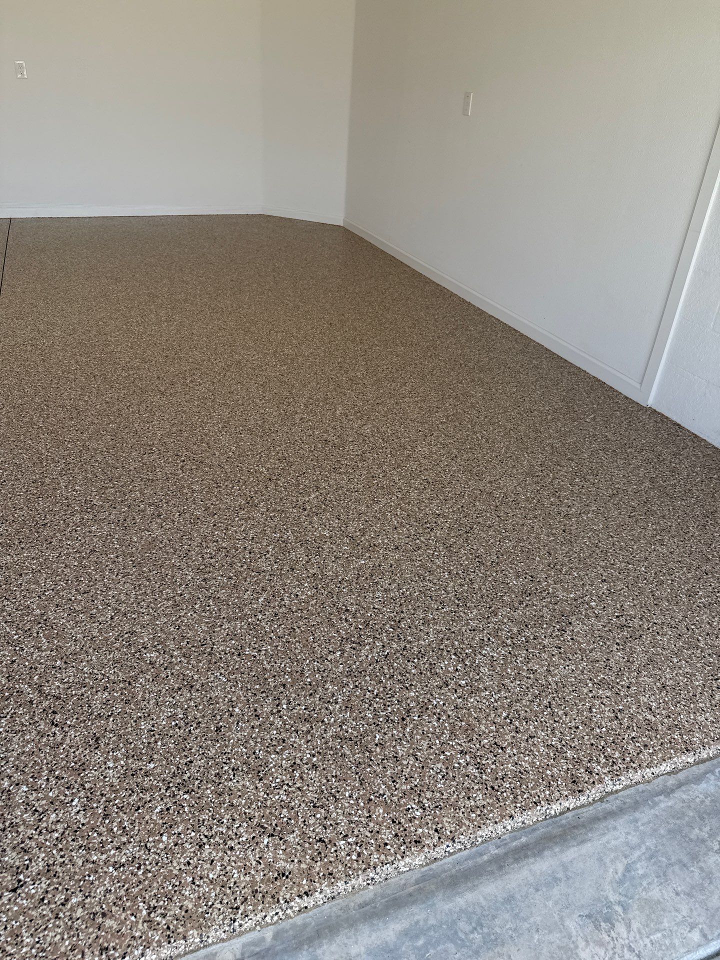 Garage and Lanai With Exterior Pad in Sandstone  by Innovative Concrete Coatings 