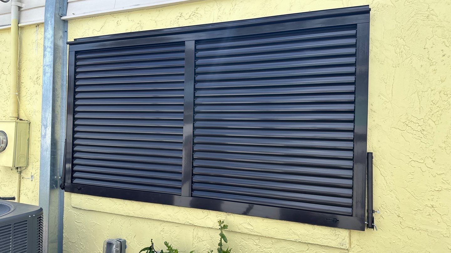 Hurricane Rated Bahama Shutters in Grey Brown by Smart Guard Shutters