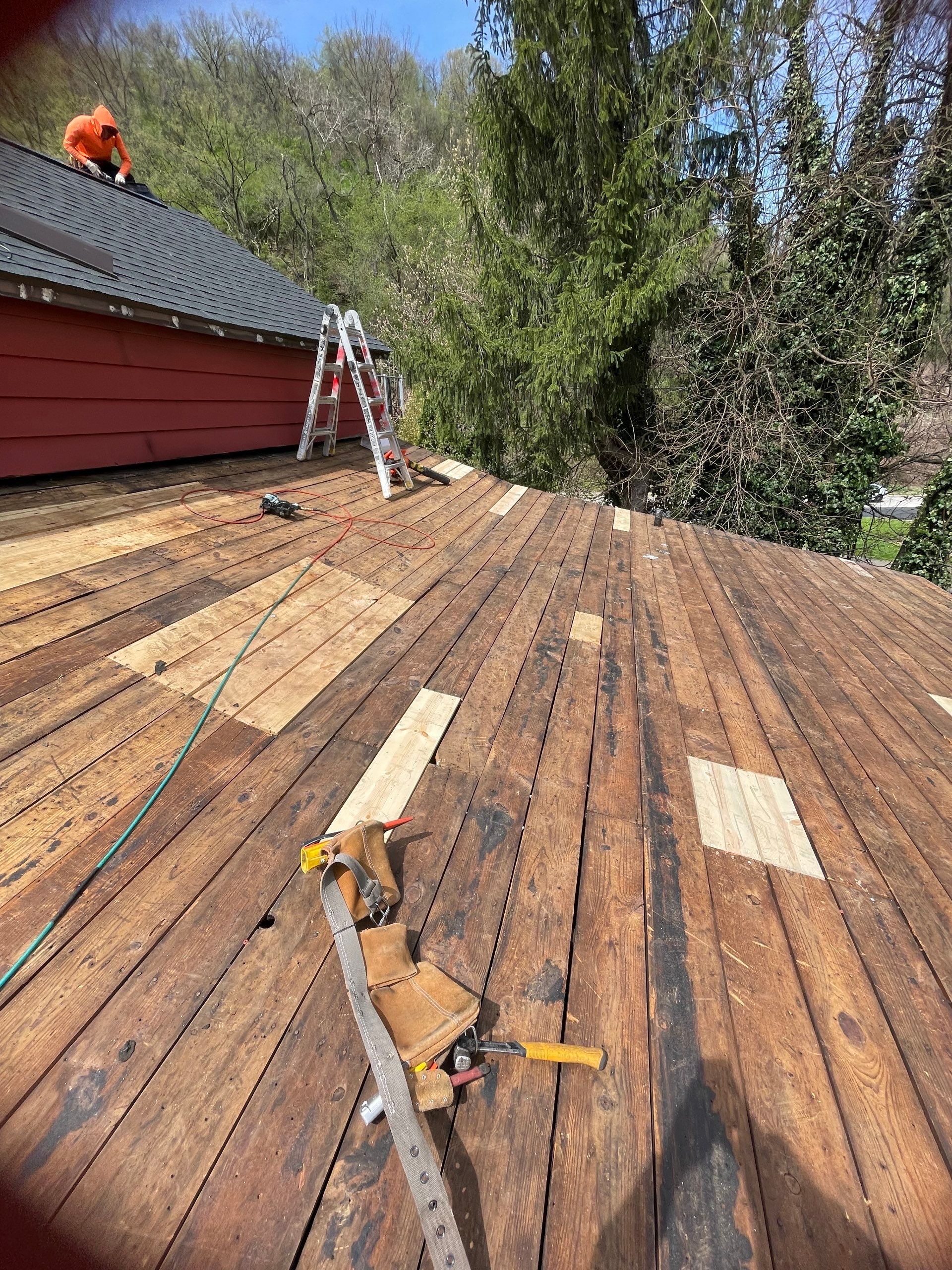 Roof sunspace deck  by Cousins Roofing Siding & Decks