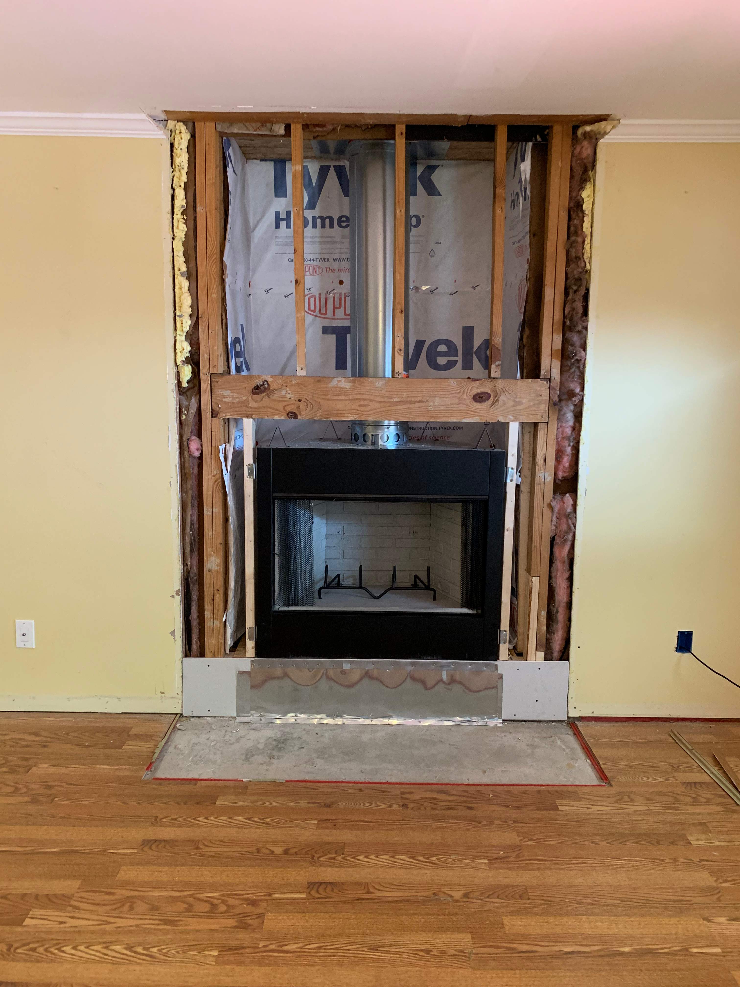 Wood Fireplace + Granite by Premier Chimney and Roofing