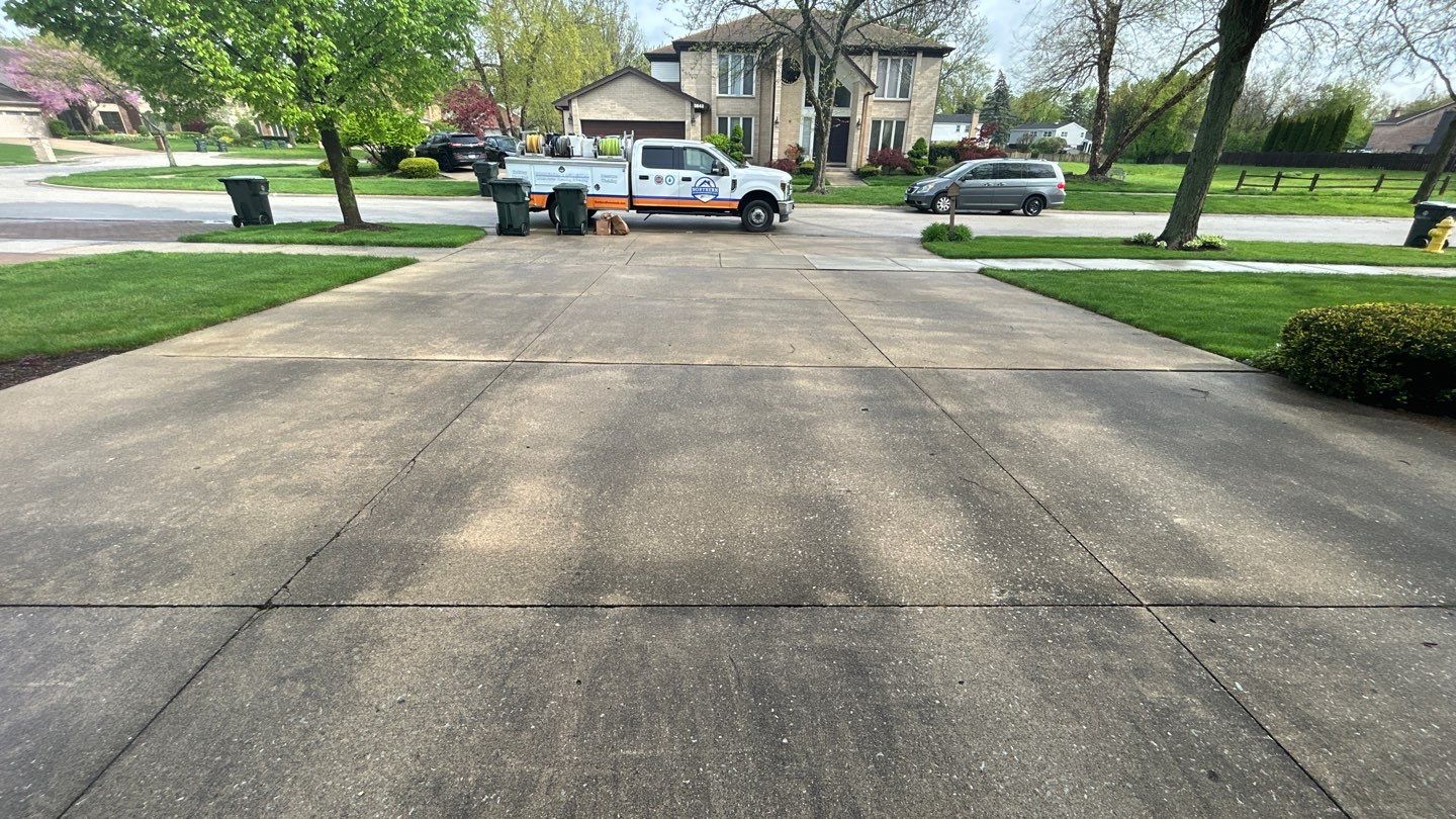 concrete patio and driveway cleaning by Northern Power Washing LLC.