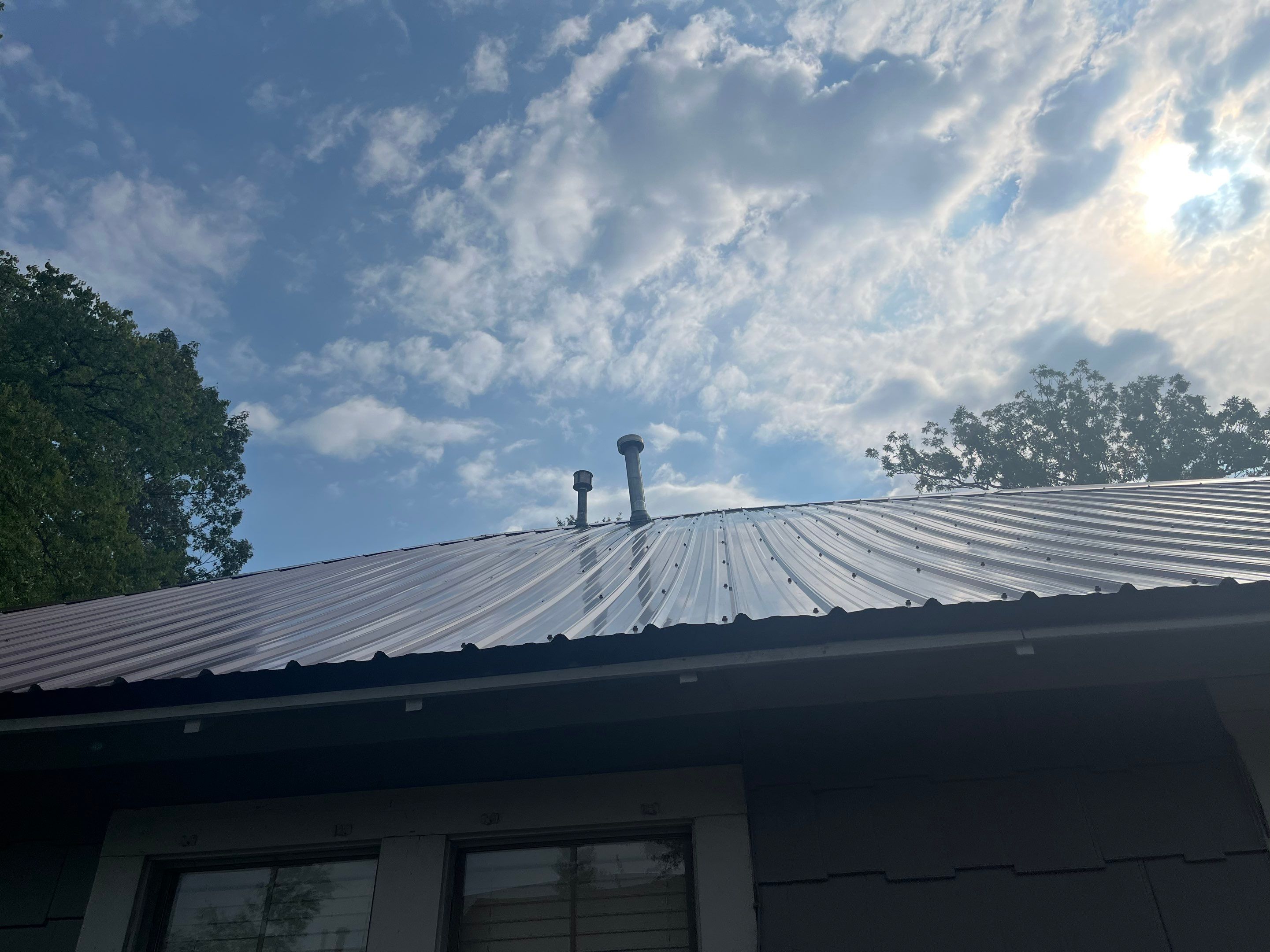 Residential Metal Roof Replacement using Reed's Metals: Colored Residental Panel (Burgundy) by Hostetler Roofing