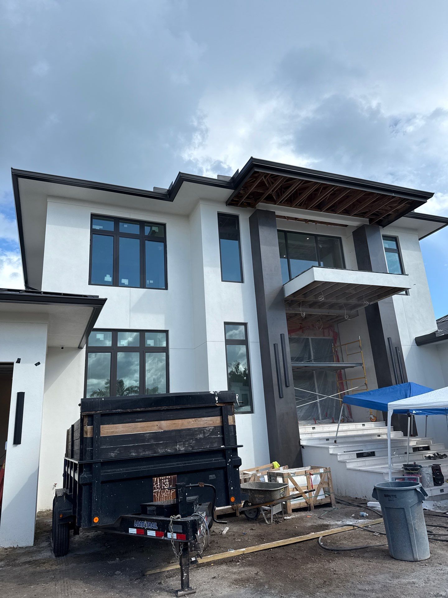 Seamless Aluminum Gutter Installation using black seamless gutters in Sarasota FL by Gutter Professors