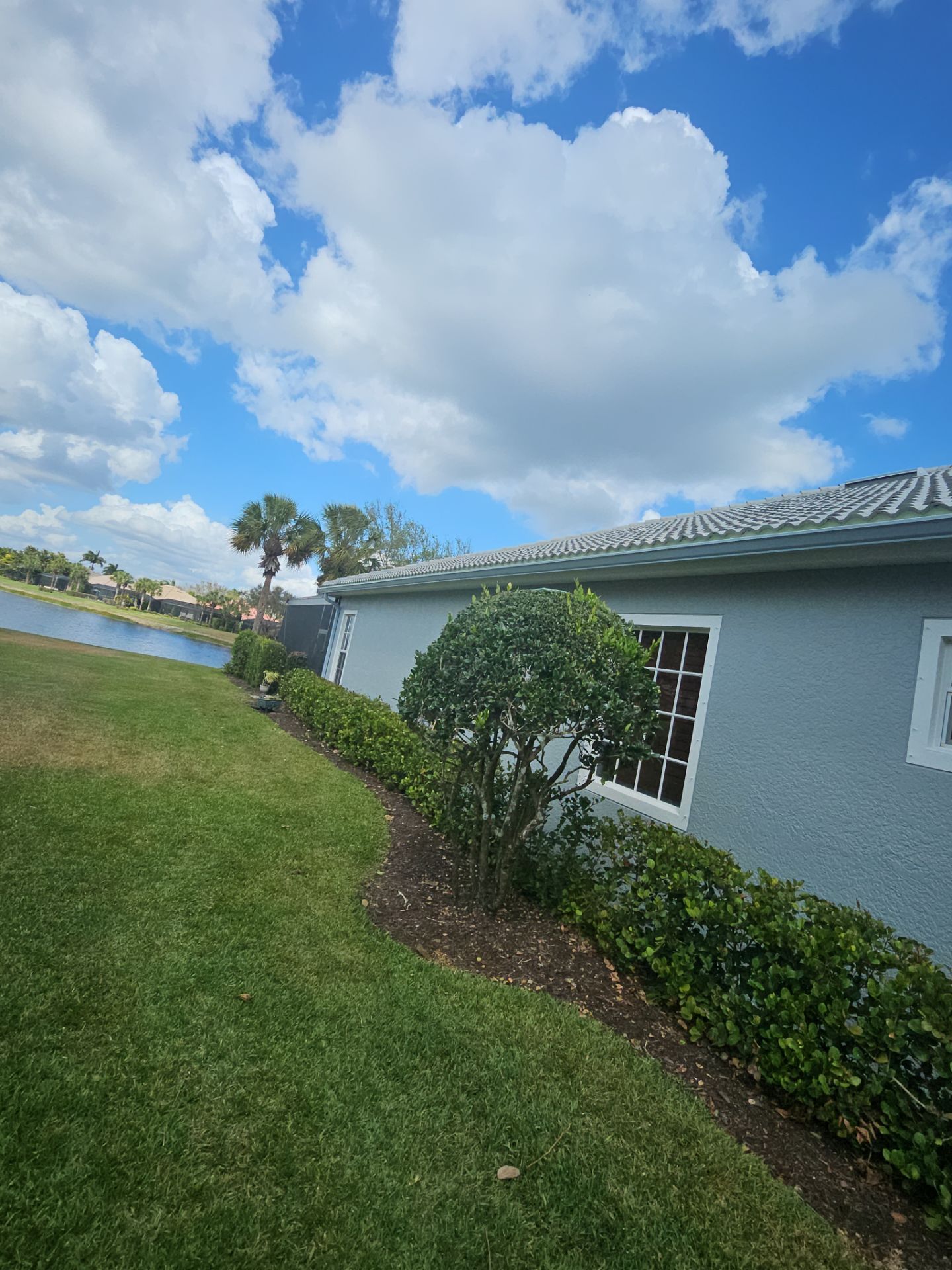6-inch K-style Seamless Gutters and Splash Guard in Grey Color in Naples FL by Gutter Professors