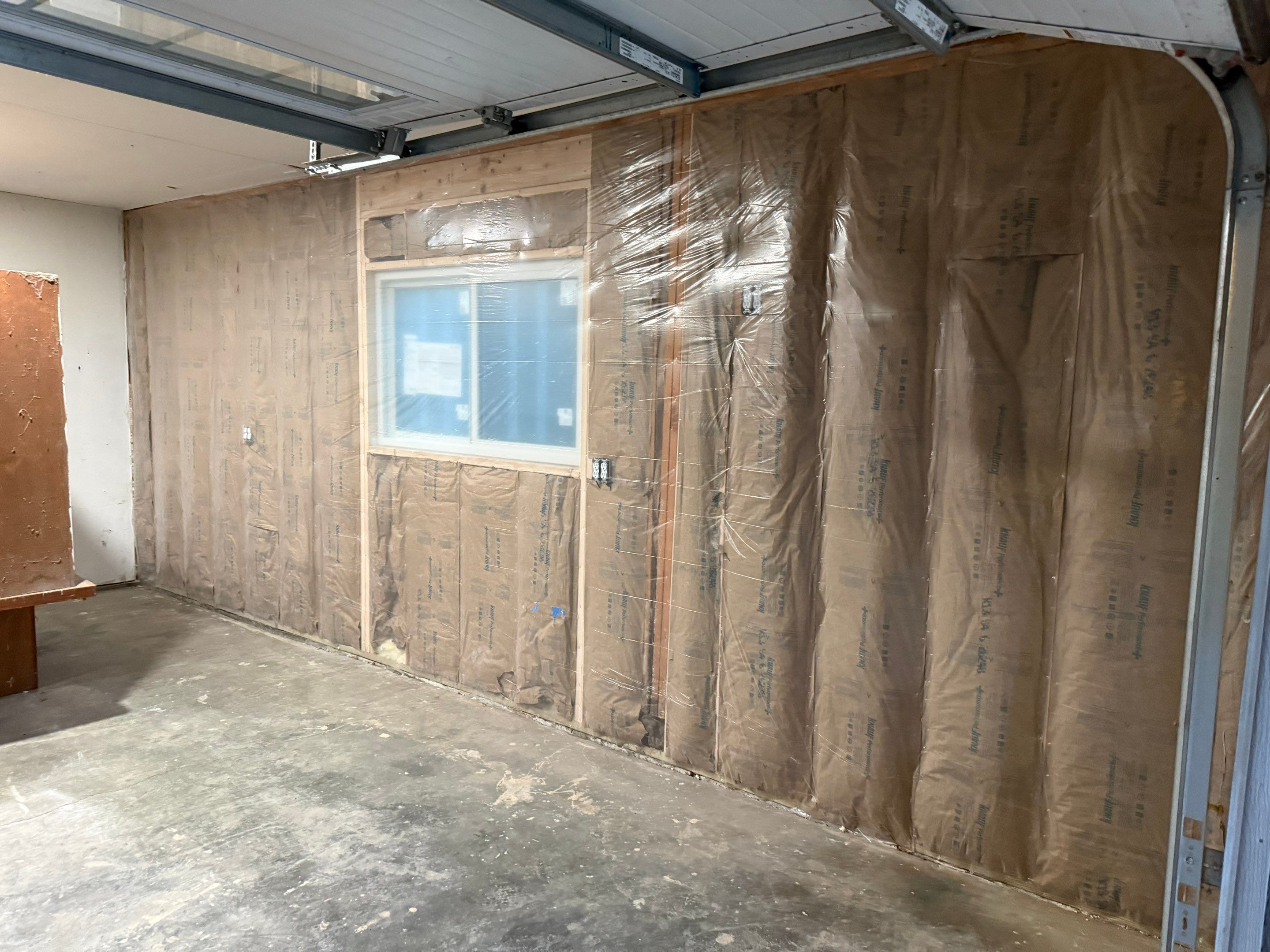 Yankton Garage Remodel with Andersen Window Installation and Drywall by Select Painting, Coatings & Garage Cabinets