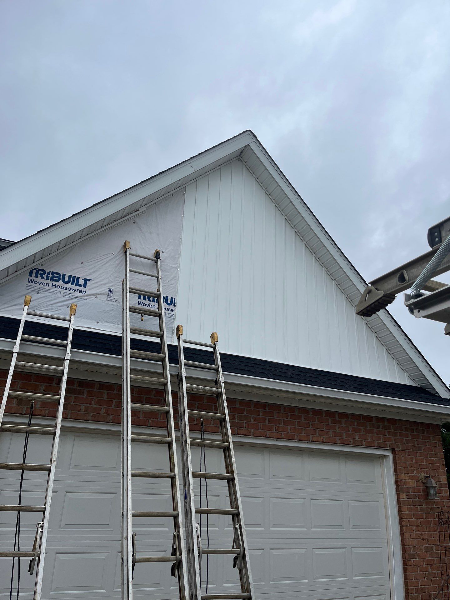 Exterior Installation using Onyx Black Durations and White Siding by WIW Enterprises Inc