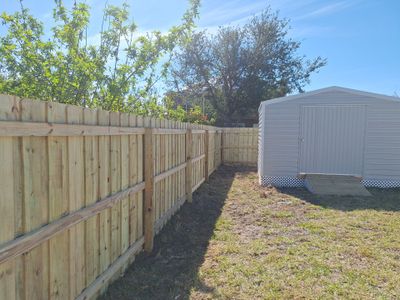 Wood Fence Installation using 6Ft Pressure Treated Wood Board On Board Privacy Fence