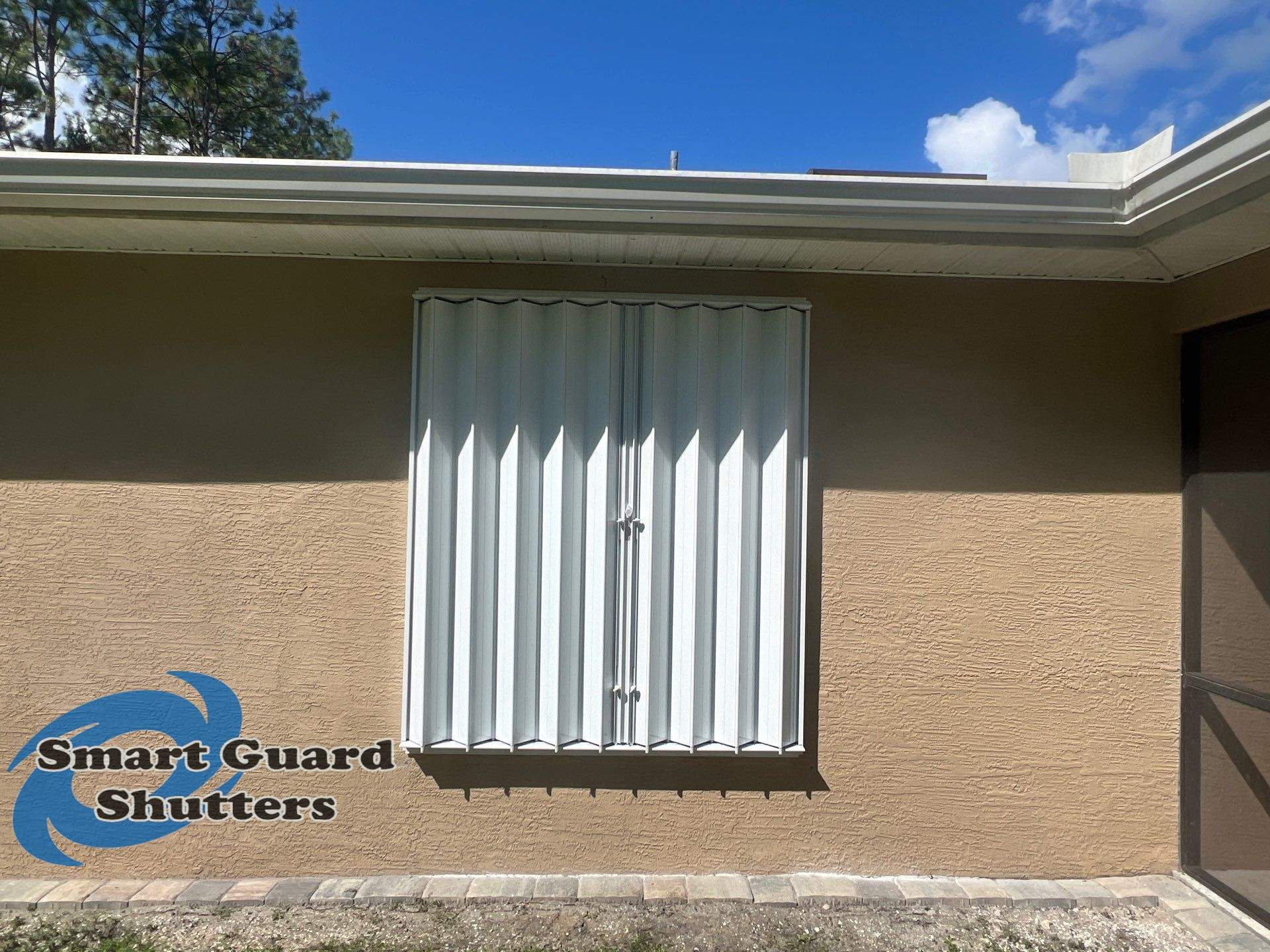 Accordion Shutters in White by Smart Guard Shutters