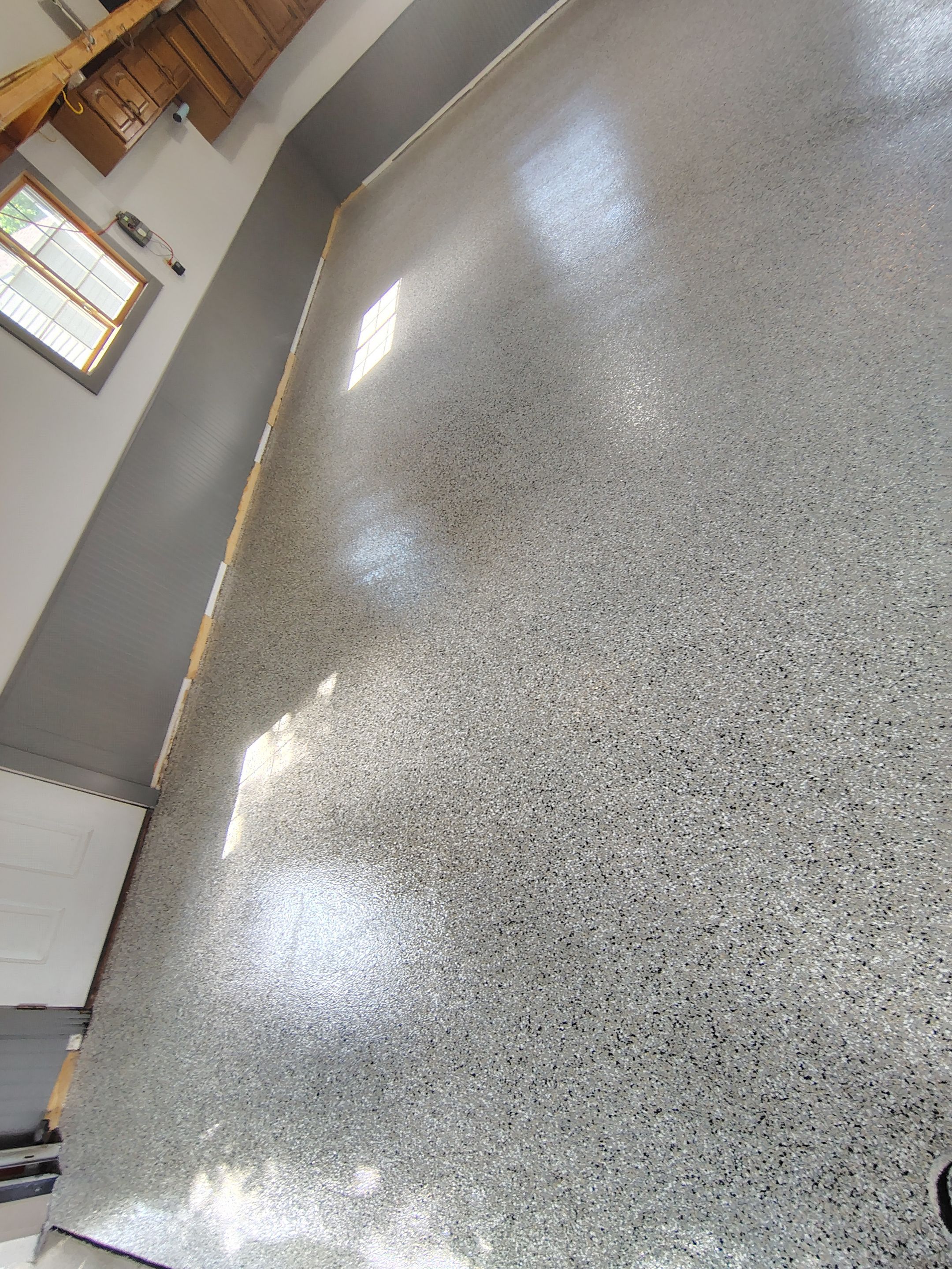 Multi-Fleck Epoxy Garage Floor Coating in Dell Rapids by Select Painting, Coatings & Garage Cabinets