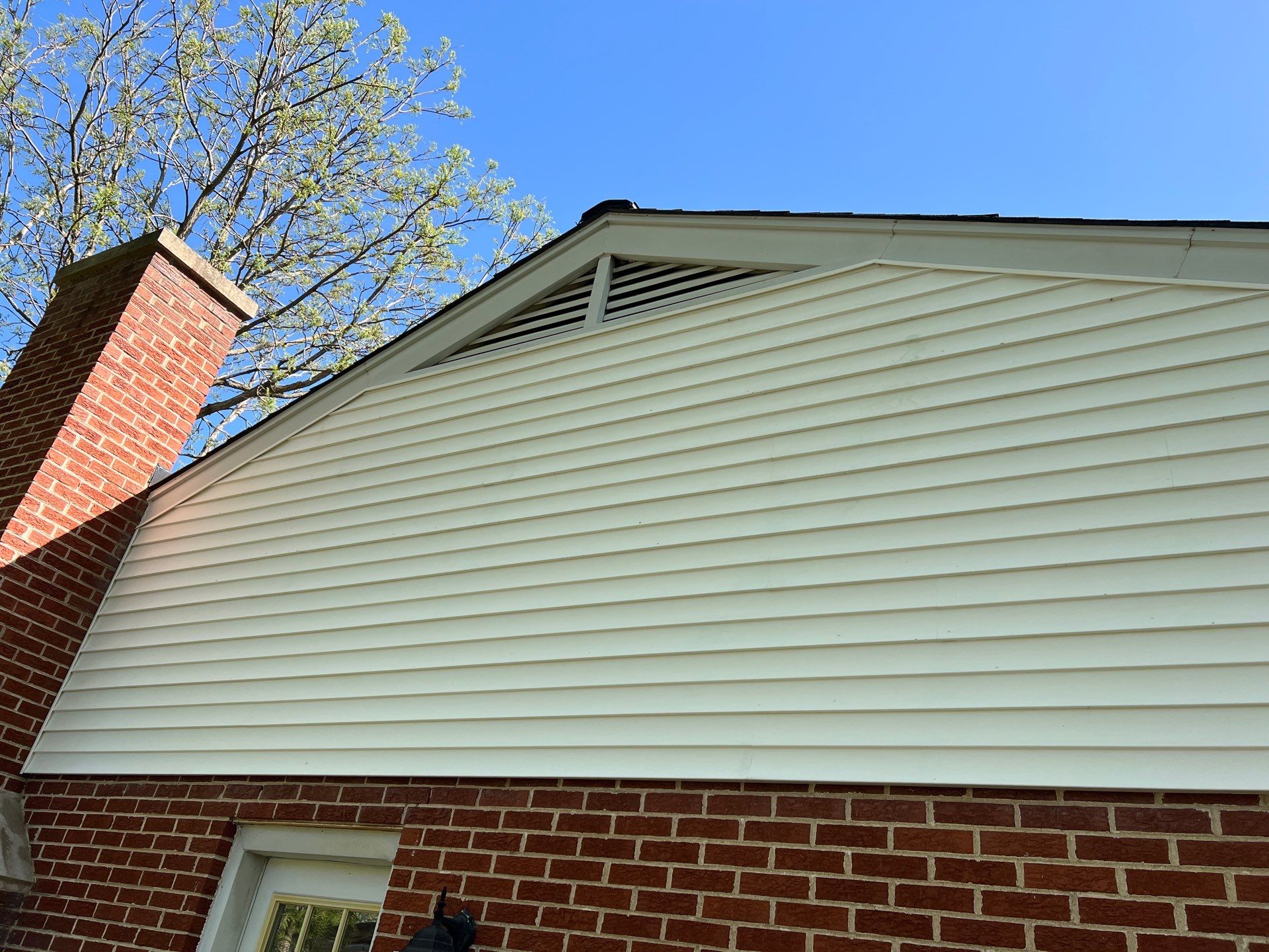 Housewashing  using Algaecide, soft wash soap by Northern Power Washing LLC.