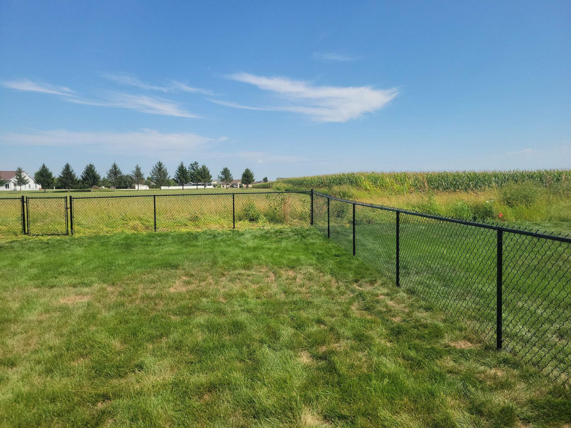 Residential Black Chain Link Fence Installation in Jesup by Perfect Picket Fence and Stain