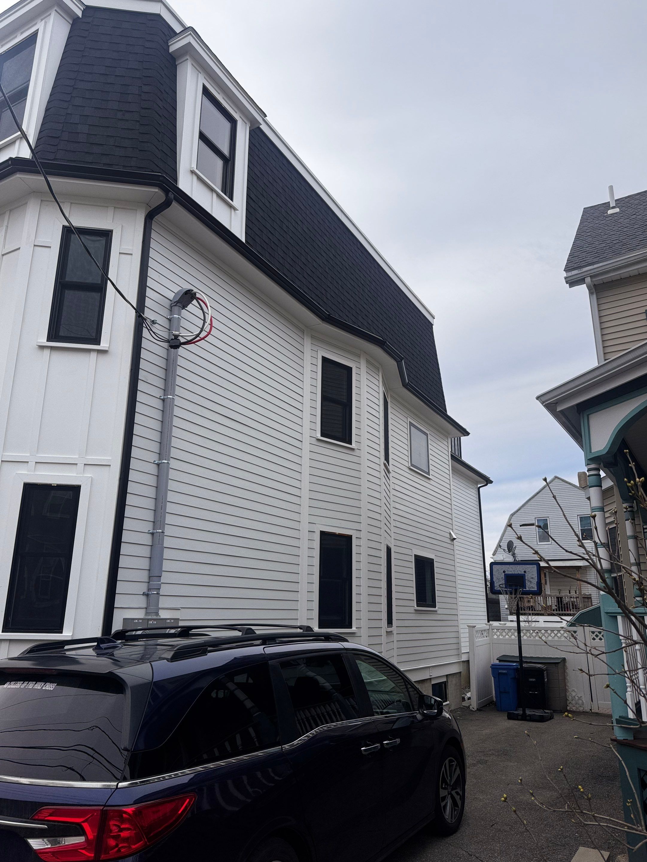 Black Gutter Installation by JOHNNYS PRO