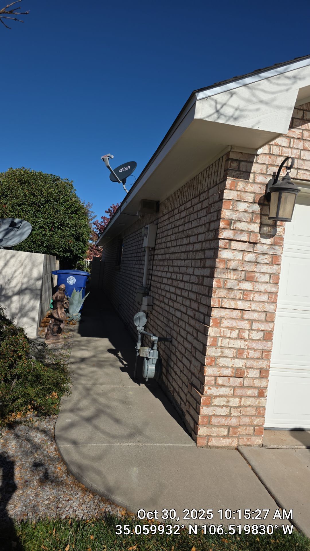 Seamless White Gutter and Downspout Installation in Albuquerque by Doyle Roof Masters Inc