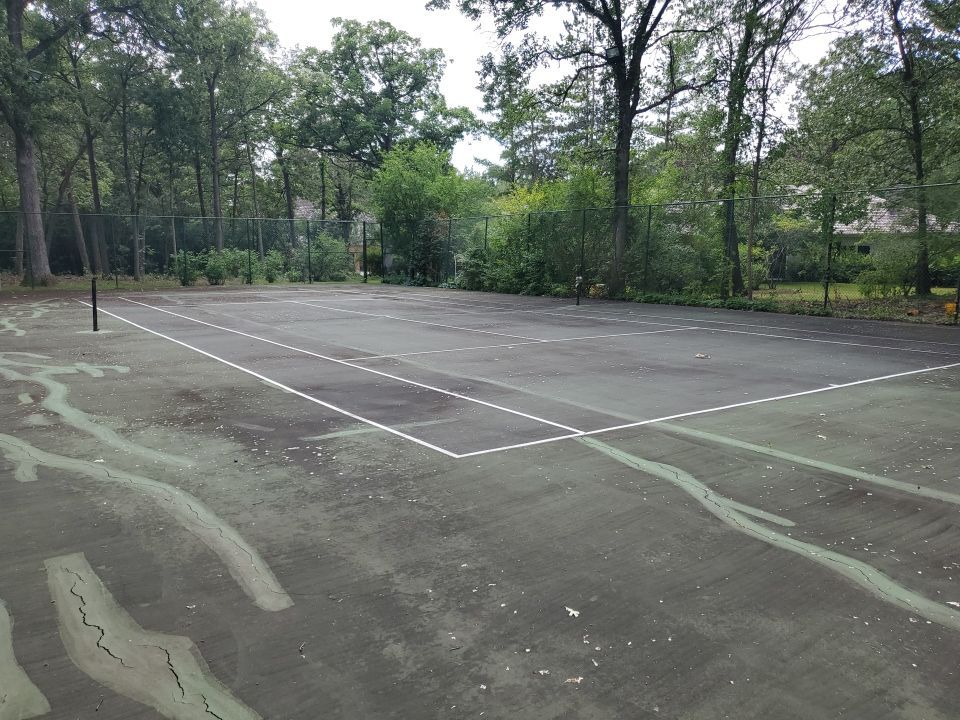 Tennis court cleaning by Northern Power Washing LLC.