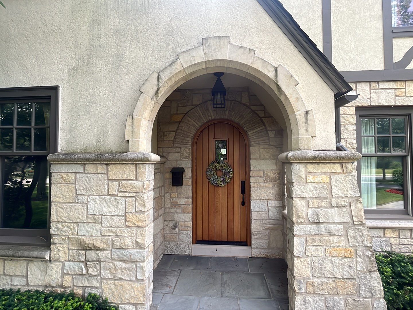 Northbrook, IL stucco home soft wash and stone cleaning by Northern Power Washing LLC.