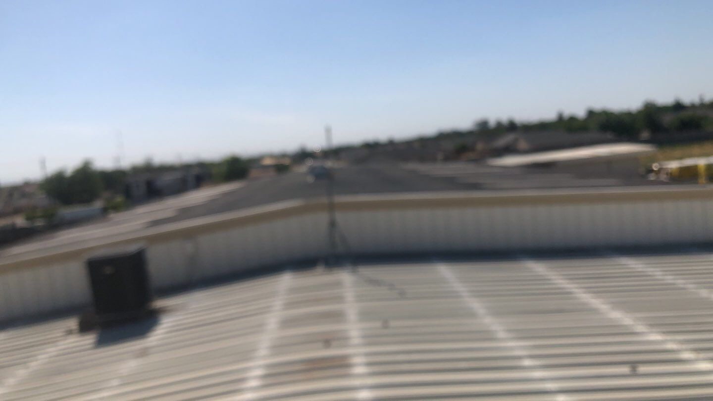 Metal Restoration Roofing system with Benchmark/PUMA XL 20 yr warranty by Straight Edge Roofing Inc