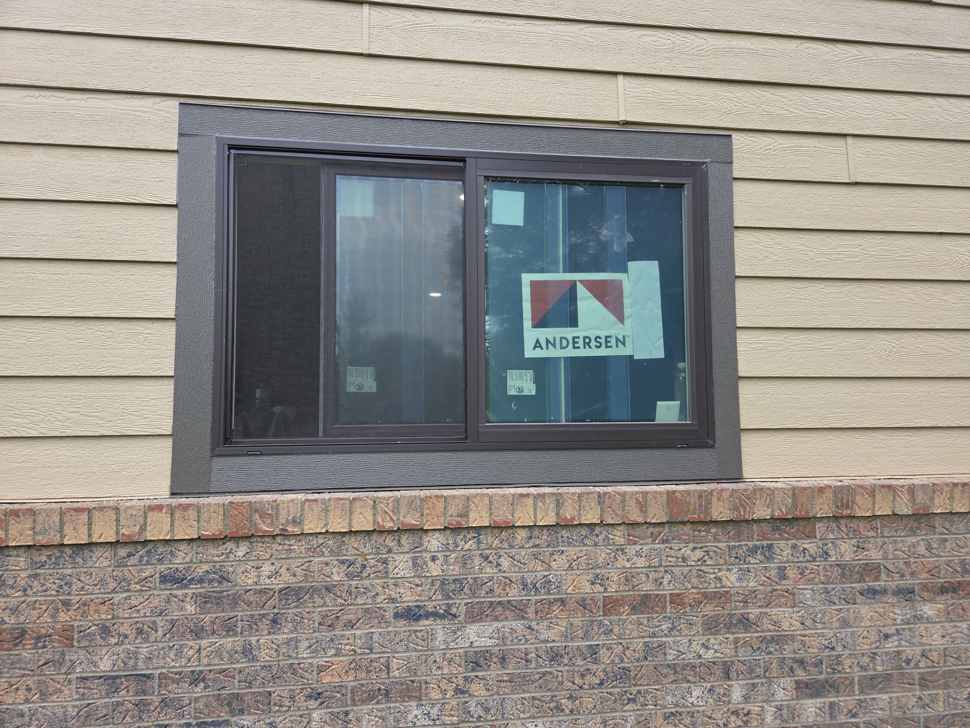 Yankton Garage Remodel with Andersen Window Installation and Drywall by Select Painting, Coatings & Garage Cabinets