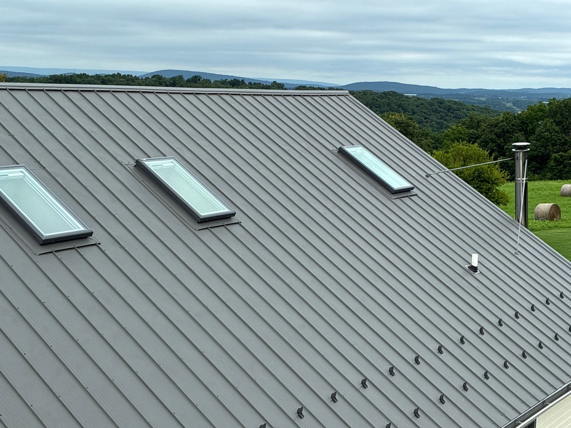 Newport Metal Roof Replacement with New Skylights by Esh Builders