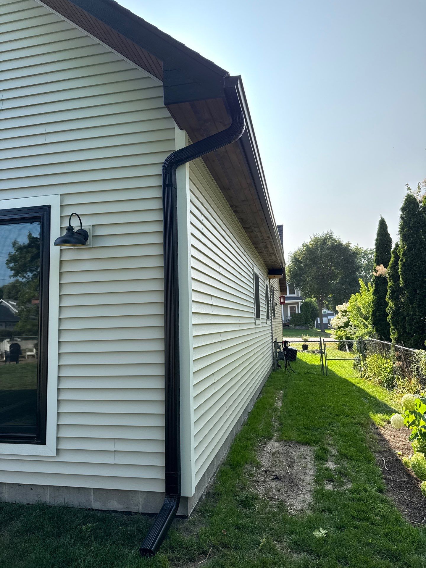 Residential Gutter and Downspout Installation in Elk Rapids by Rainbow Seamless Systems