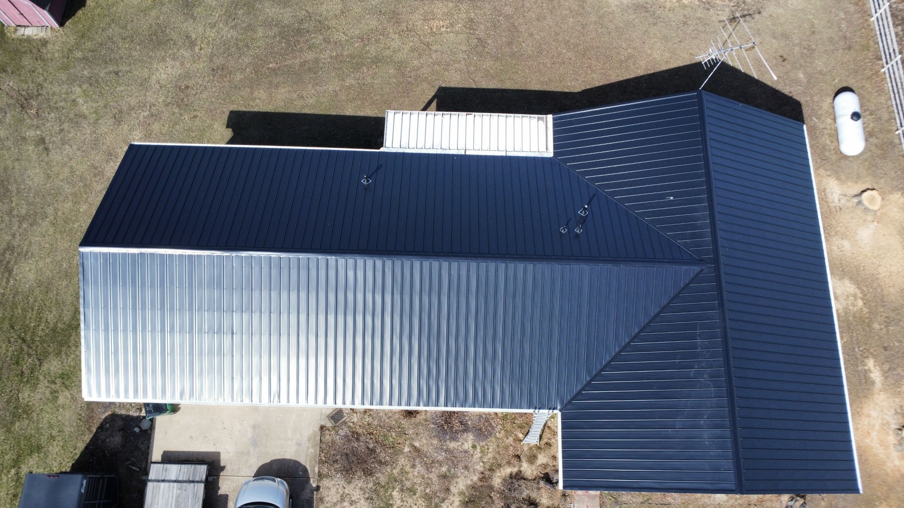 Residential 26 Gauge M-Rib Metal Roof + Gutters, Downspouts & Gutter Covers Install  by Titan Commercial & Residential Roofing 