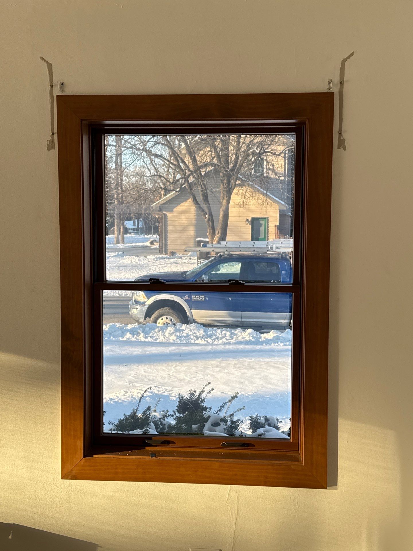 Black-Frame Pella Lifestyle Upgrade on a Partial Brick Home by United Windows and Siding LLC