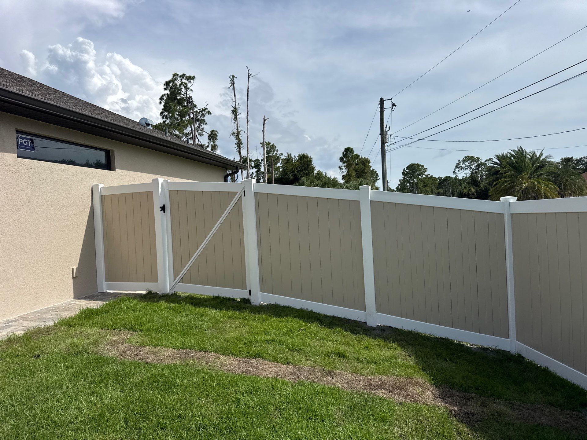 Custom Two-Tone Vinyl Privacy Fence Installation in North Port by True Fence LLC