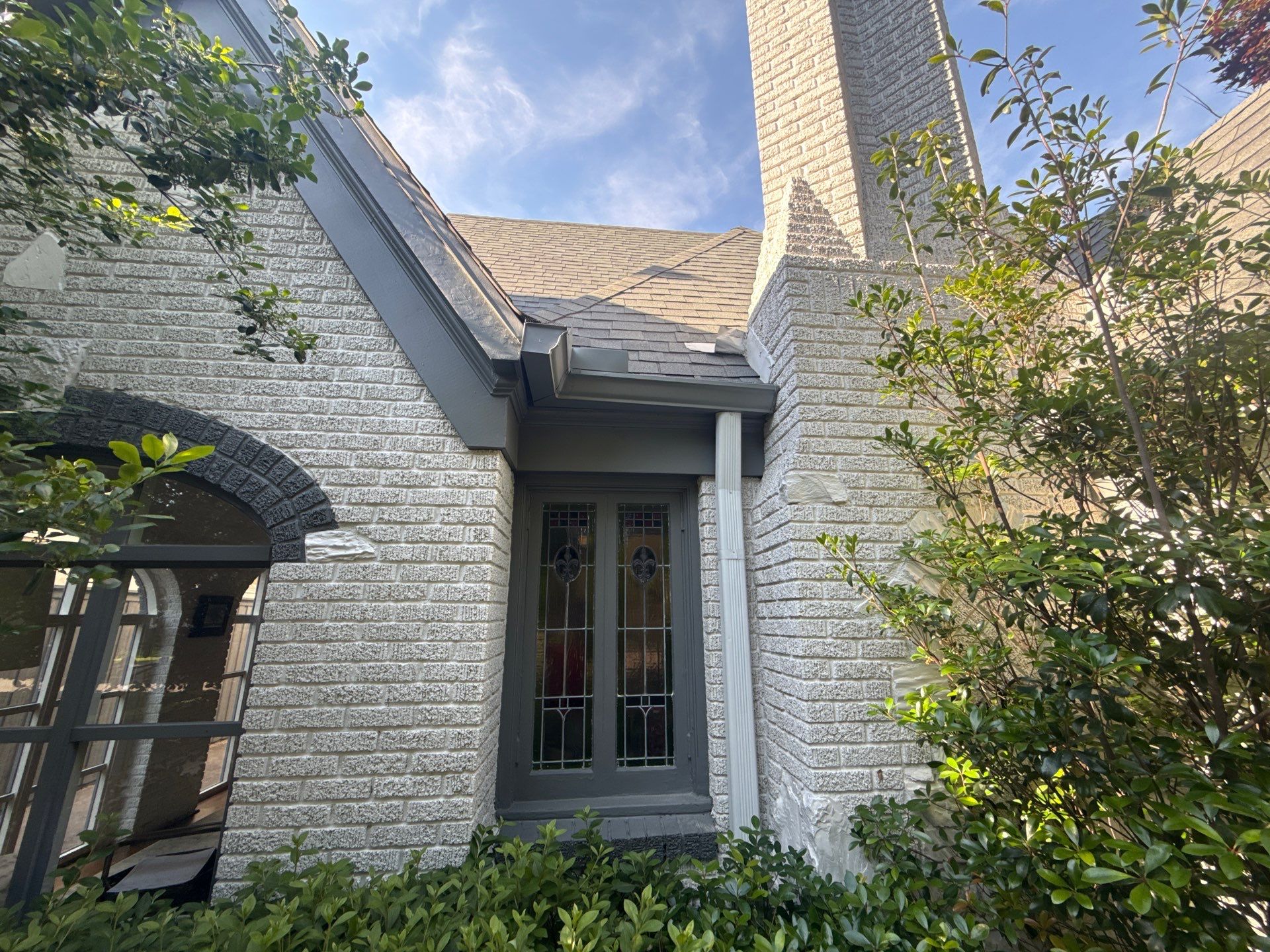 Residential Gutter Installation and Exterior Maintenance for Dallas White Brick Home by First Out Roofing 