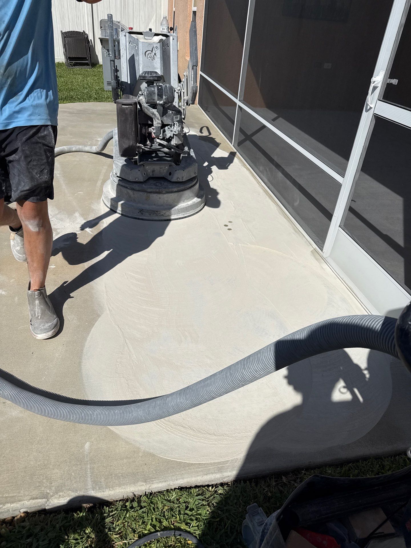 Garage and Lanai With Exterior Pad in Sandstone  by Innovative Concrete Coatings 