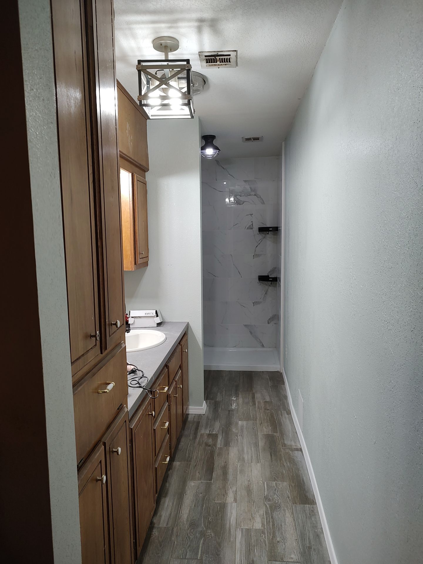 Bathroom remodel w/shower upgrade by In & Out Construction & Remodeling, LLC