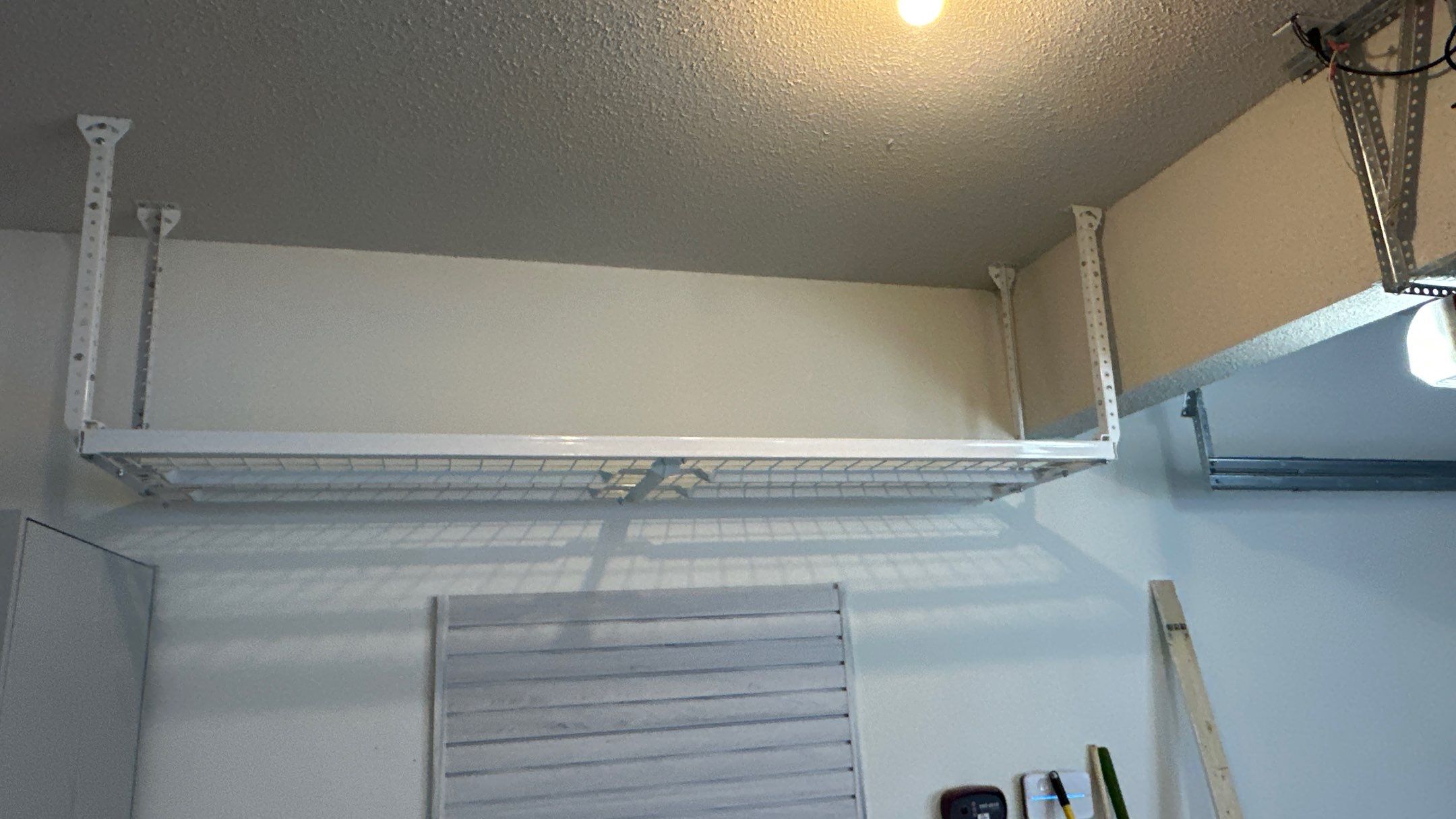 Carly U chose platinum powder coating for her cabinets by Banner Garage