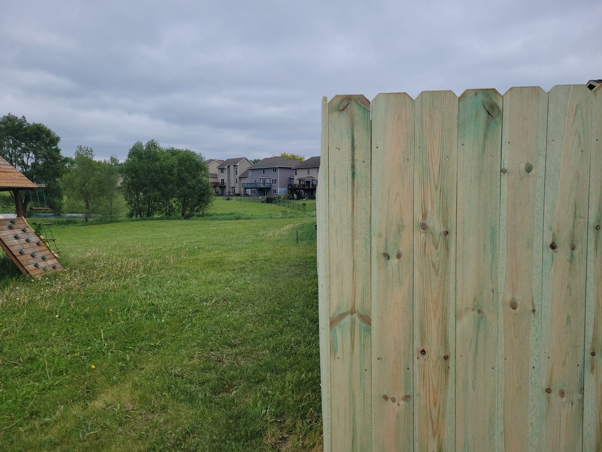 Pressure-Treated Wood Privacy Fence Installation in Waterloo by Perfect Picket Fence and Stain