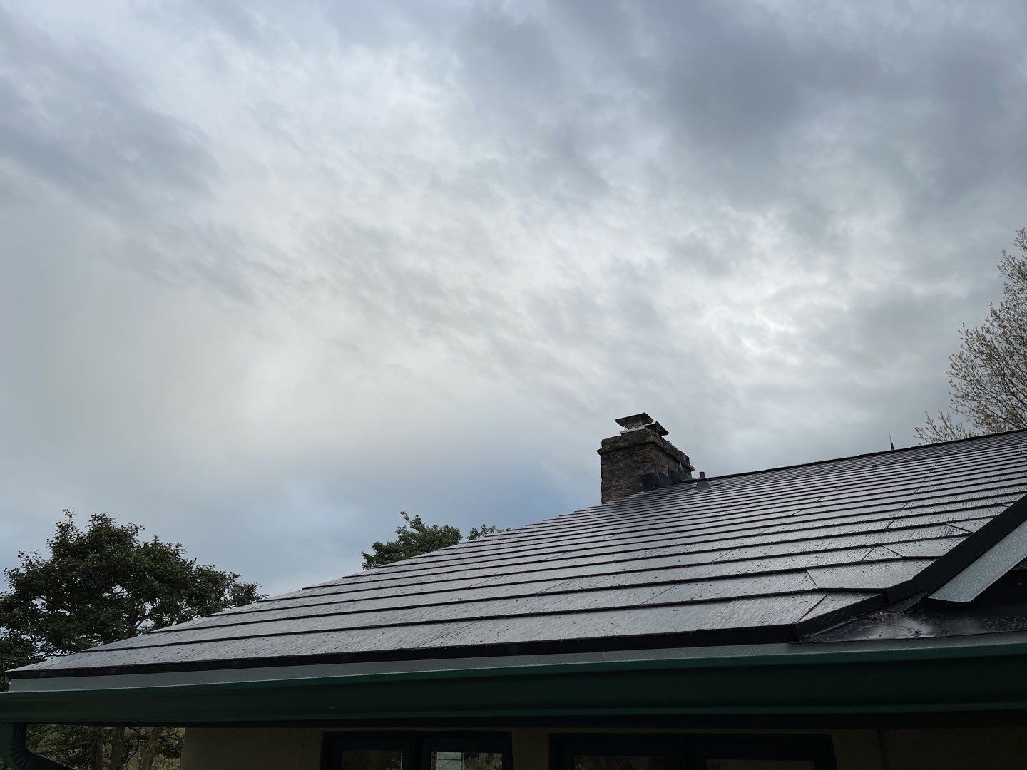 Tesla Solar Roof Replacement by American Home Contractors
