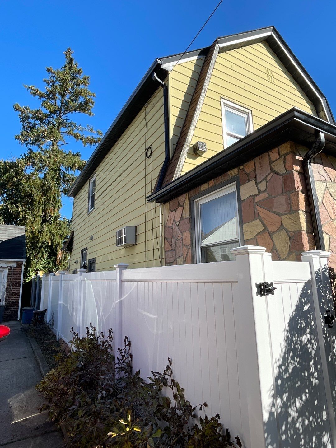 Full House Installation 5" black seamless gutters and 2x3 leaders using 5" black K style seamless gutters and 2x3 black leaders by Above All Gutters 