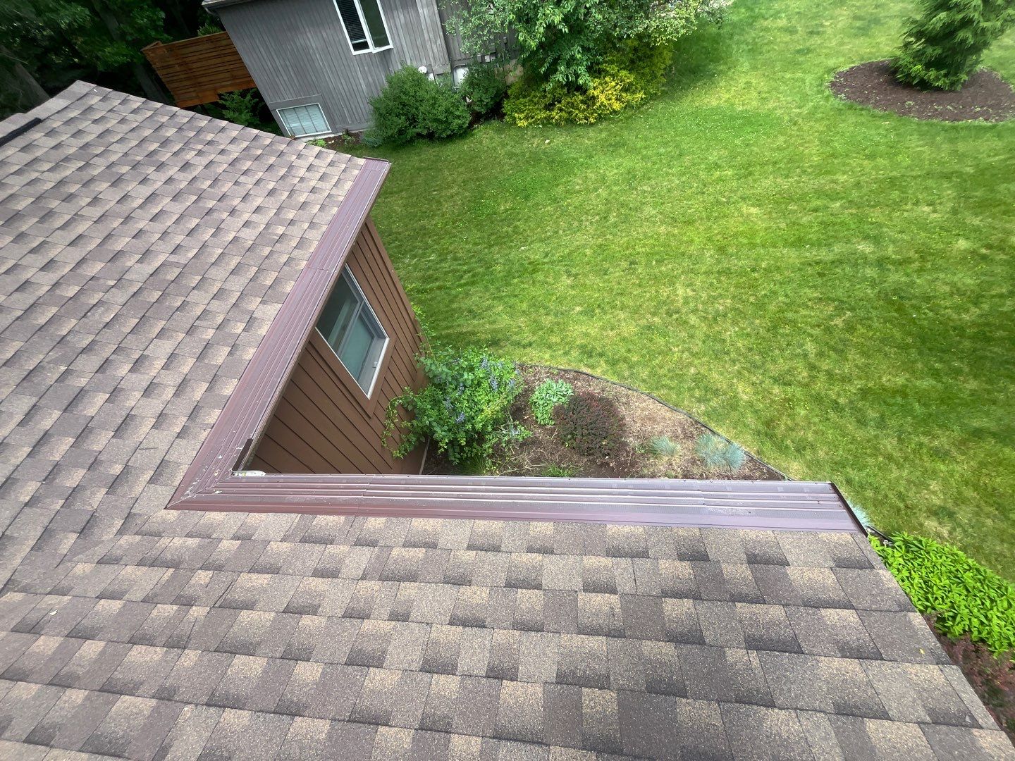 Installing new Roof and Gutter Protection after Hail Damage by Acme Exteriors