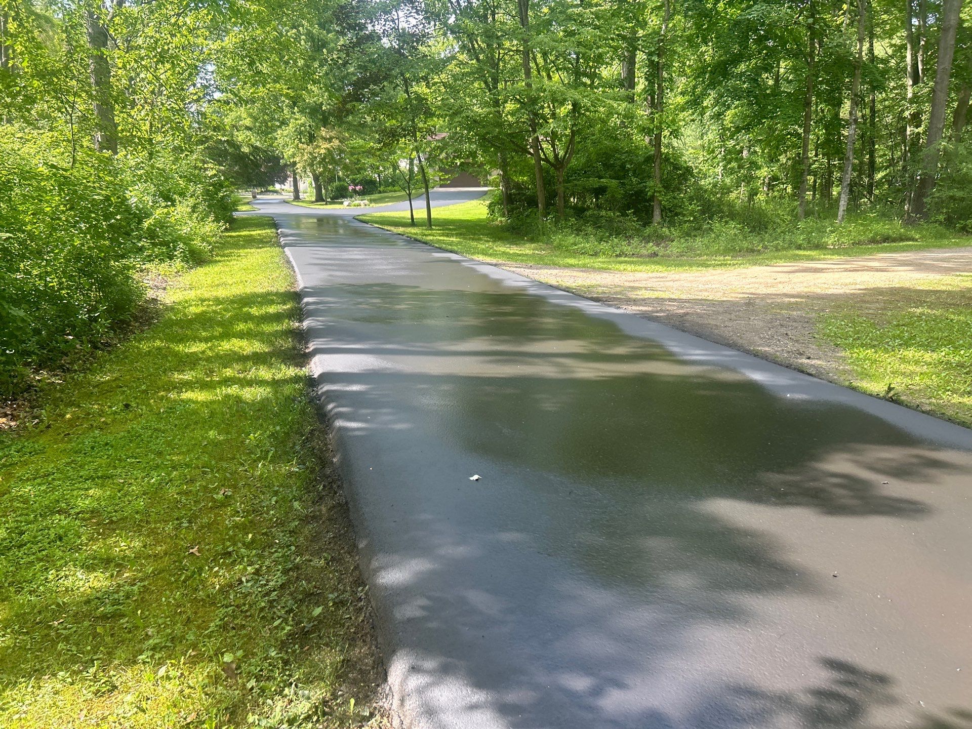 High end residential driveway by Quality Asphalt & Maintenance LLC