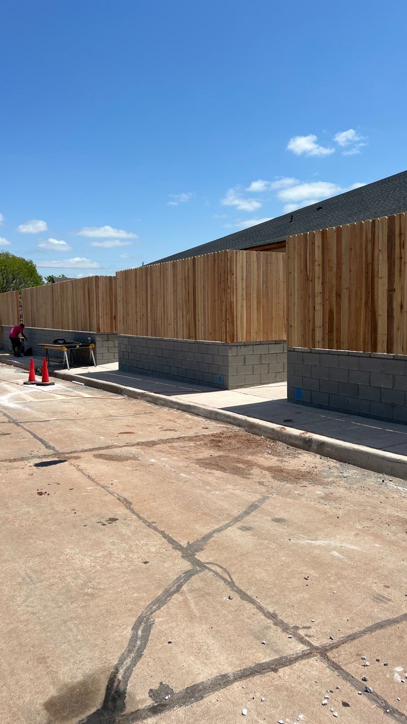 Cedar Fence using Cedar Pickets and Metal Poles by Clays Services Inc