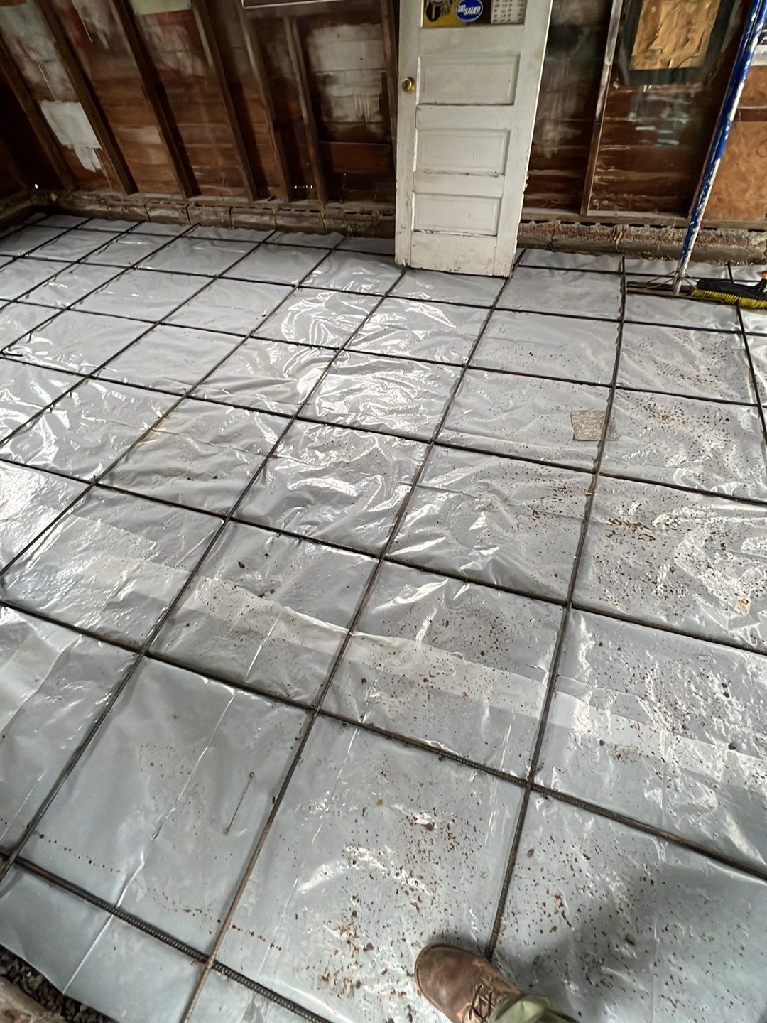 Broom finished patio and garage floor replacement  by NG Masonry & Construction LLC