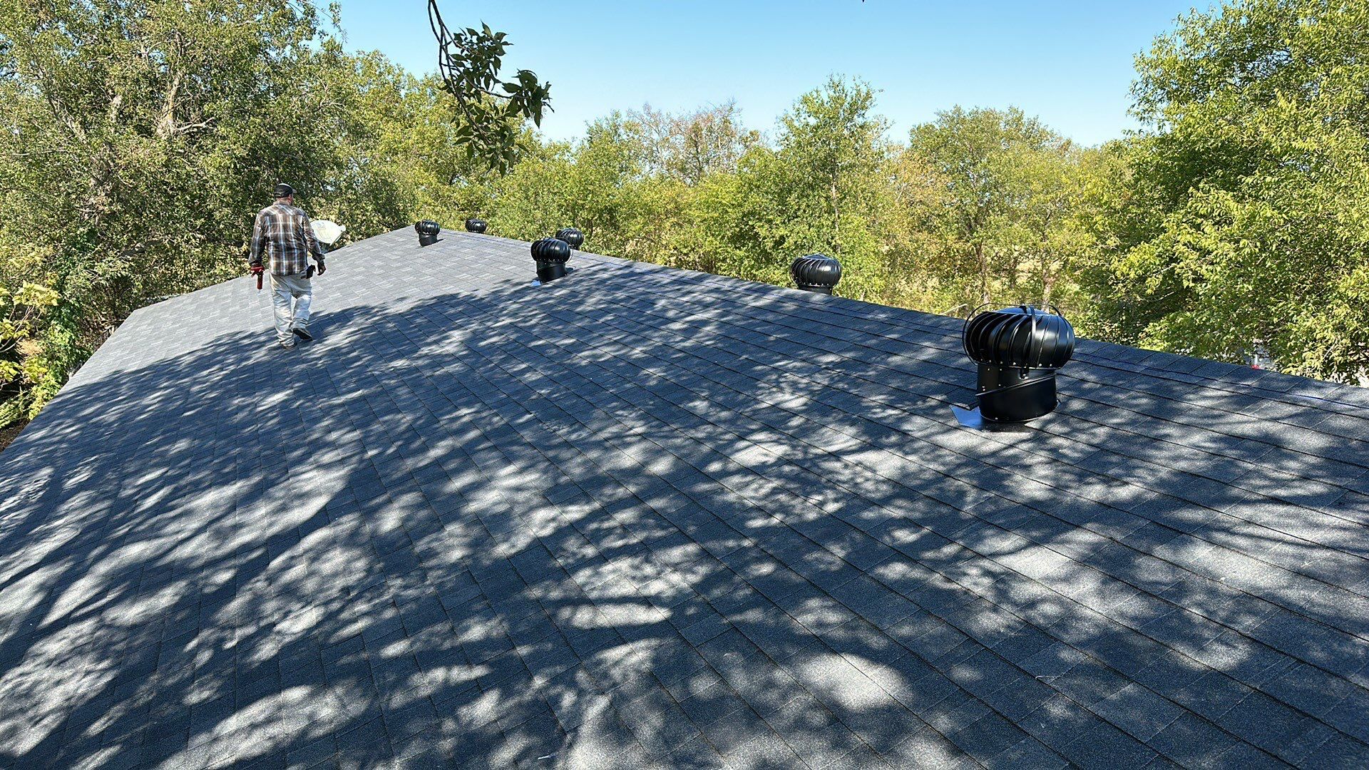 Atlas-Pristine Black with White Siding by Tejas Roofworks + Restoration