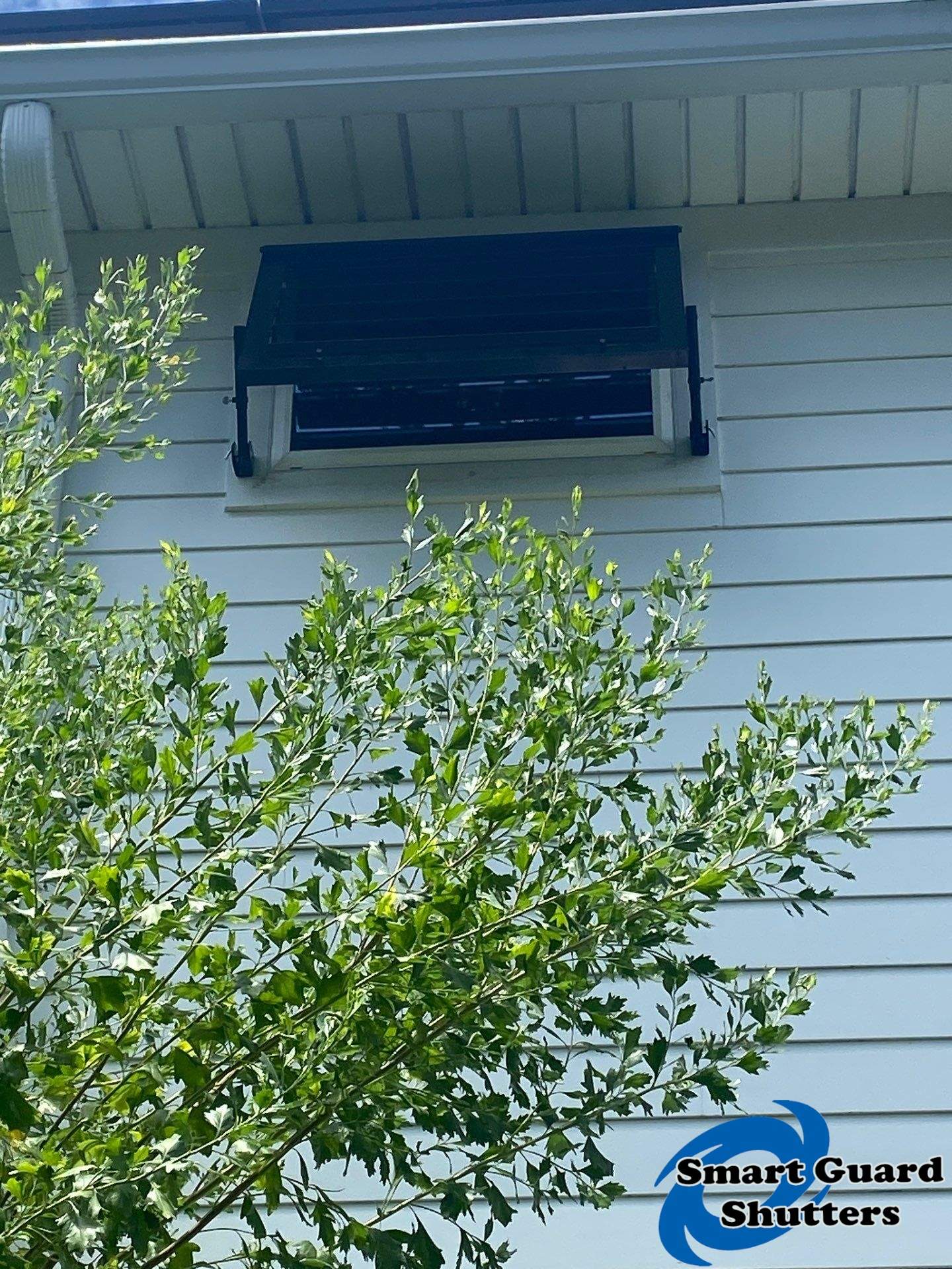 Impact Bahama Shutters in Jet Black by Smart Guard Shutters