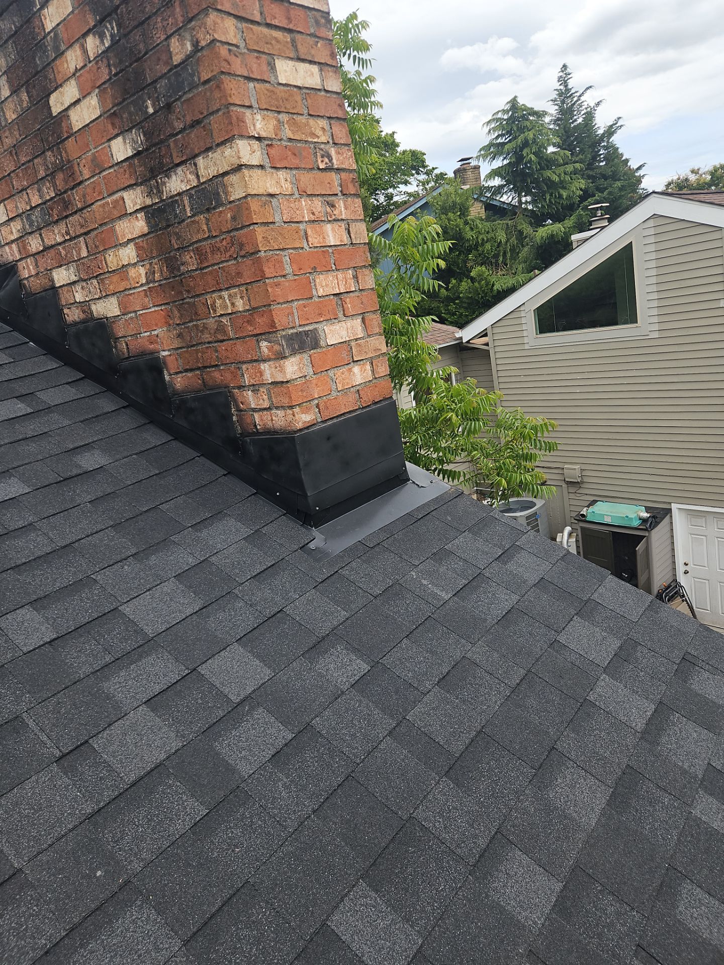 Residential Roofing Installation using IKO Dynasty (Color: Granite Black) by Orezona Building & Roofing Company, Inc.
