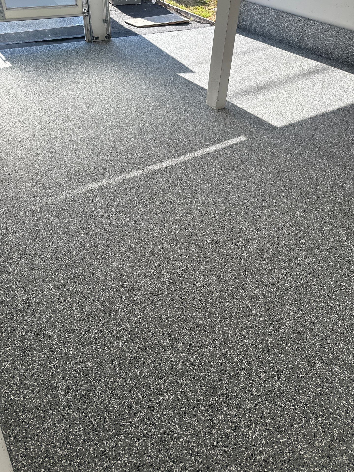 Polyurea Garage Floor Coating with Simiron Wombat Chip Finish by MGP Coatings