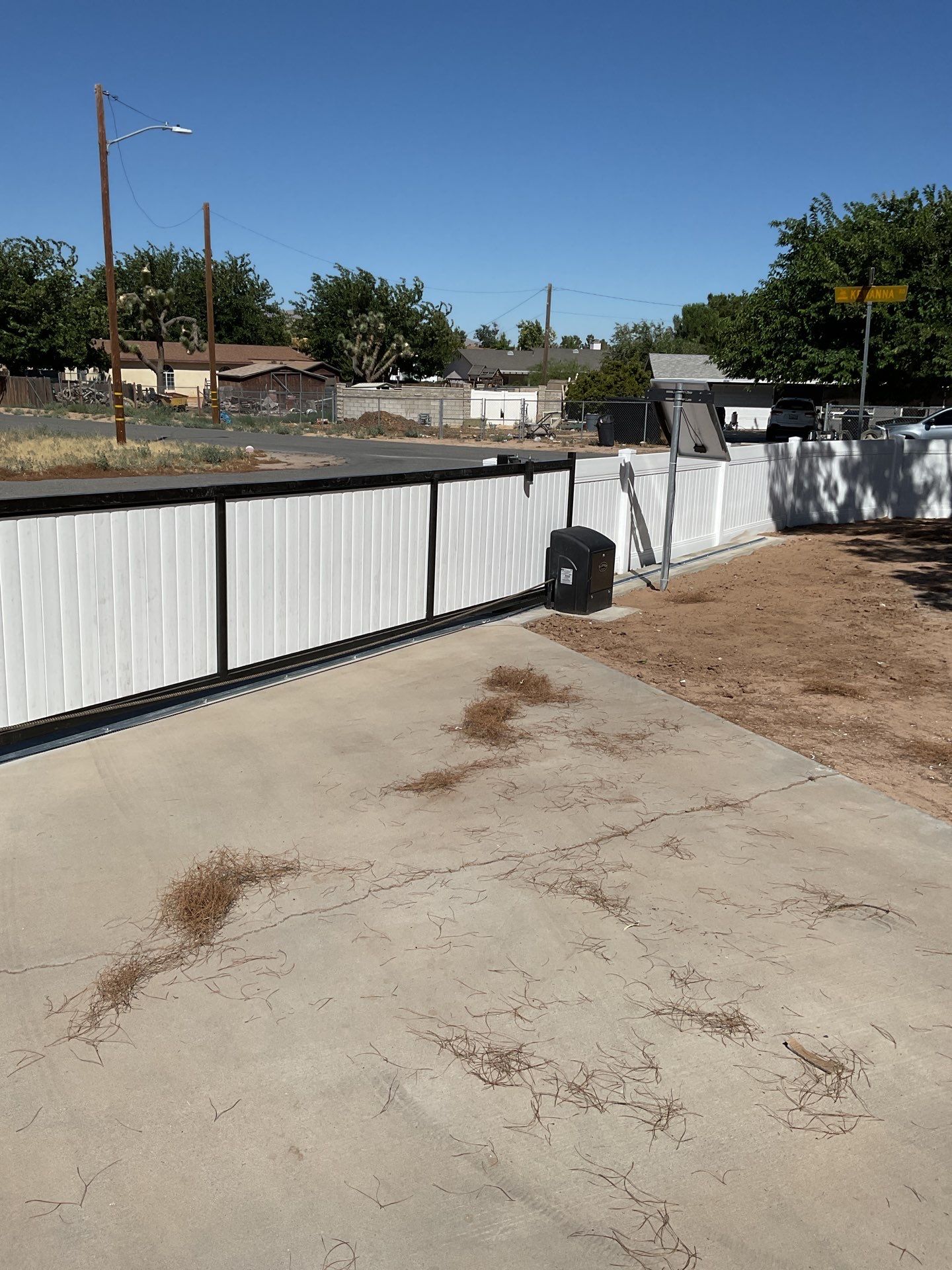 4ft White Vinyl Fence with Solar Power Motorized Gate by Fence Guys Inc.