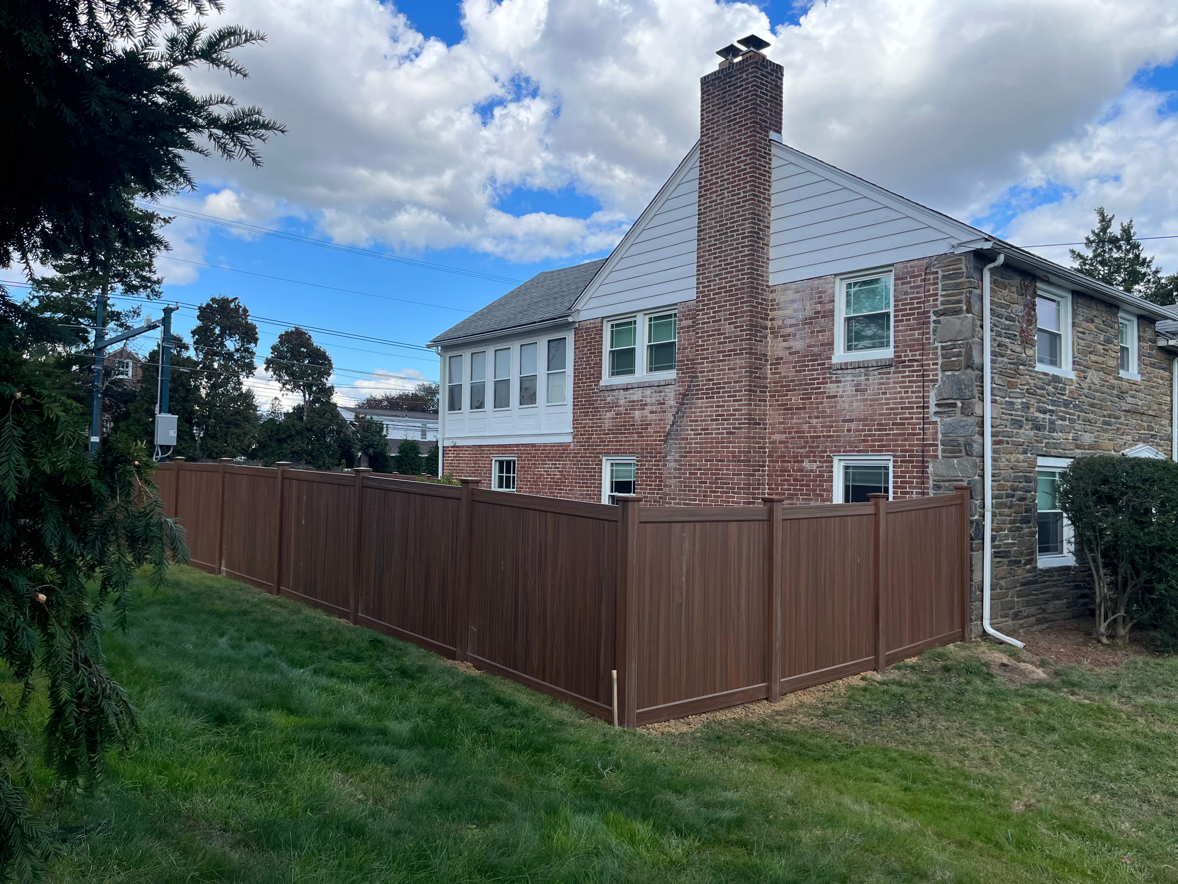 6' High Mocha Walnut Vinyl Installation by Jensen Fencing
