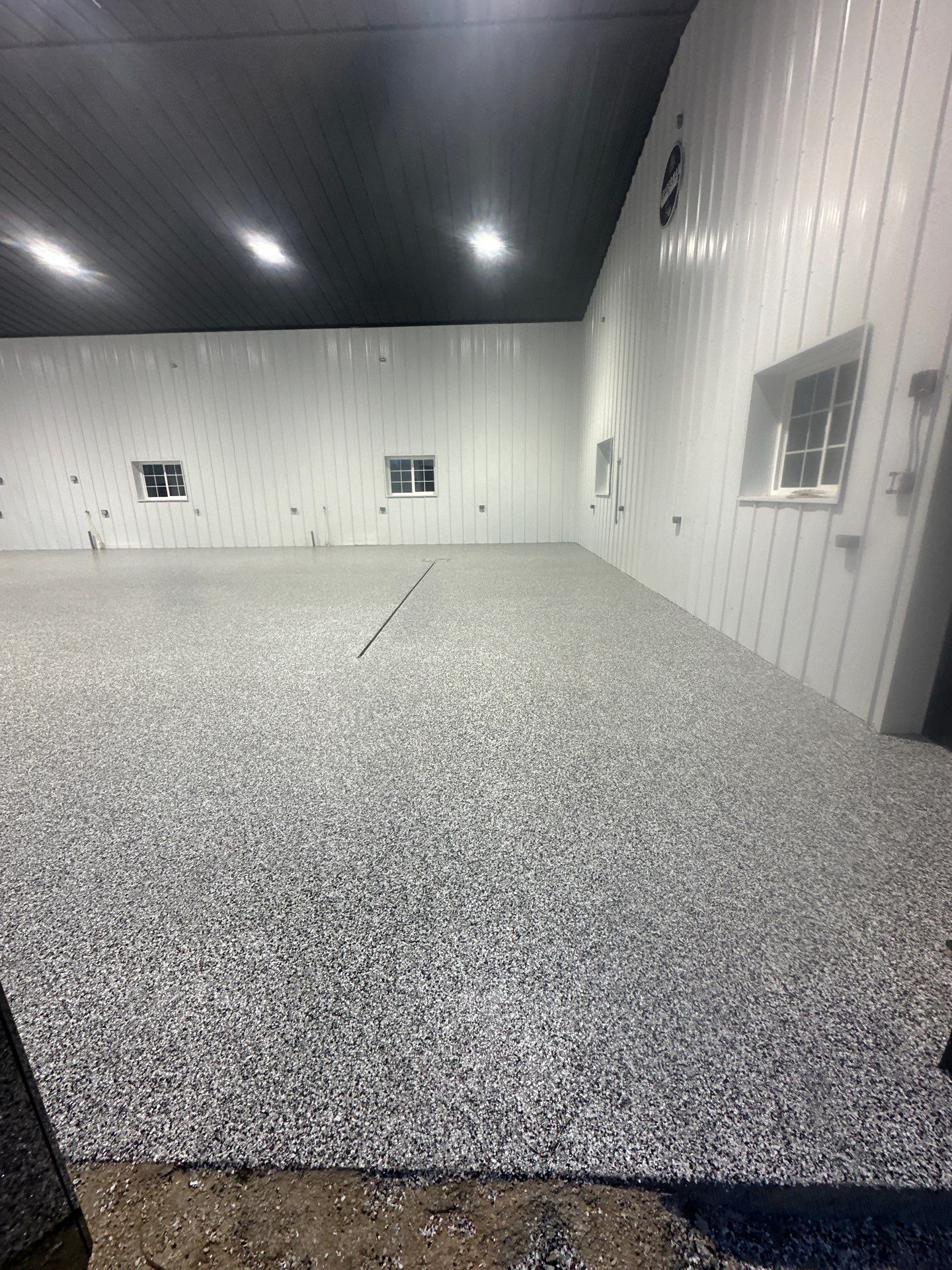 Barndominium Flake Coating using Polyaspartic by Revival Concrete Coatings
