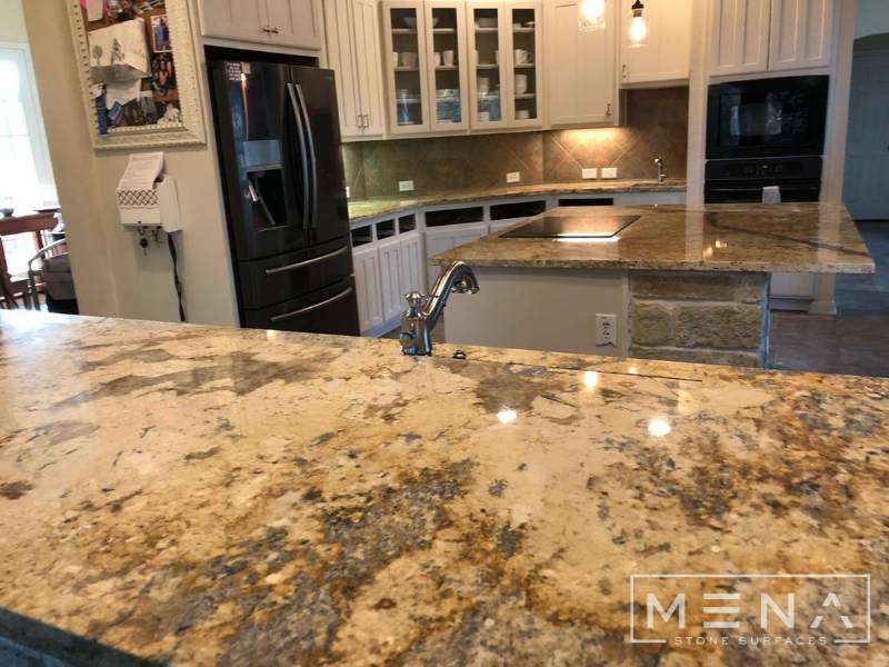 Kitchen countertops using Yellow River Granite  by Mena stone surfaces