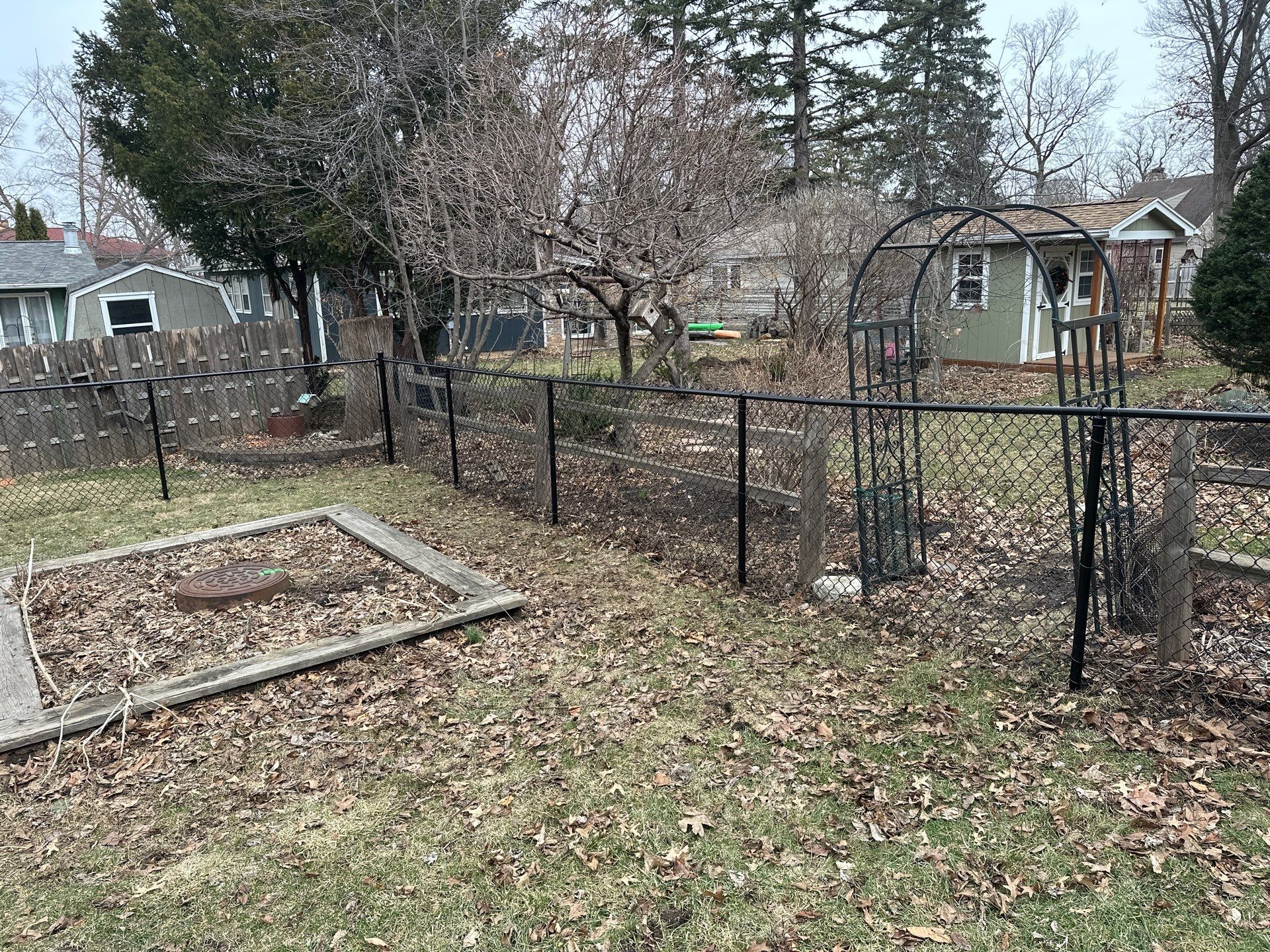 Black Vinyl Chain Link Fence Installation in Cedar Falls by Perfect Picket Fence and Stain