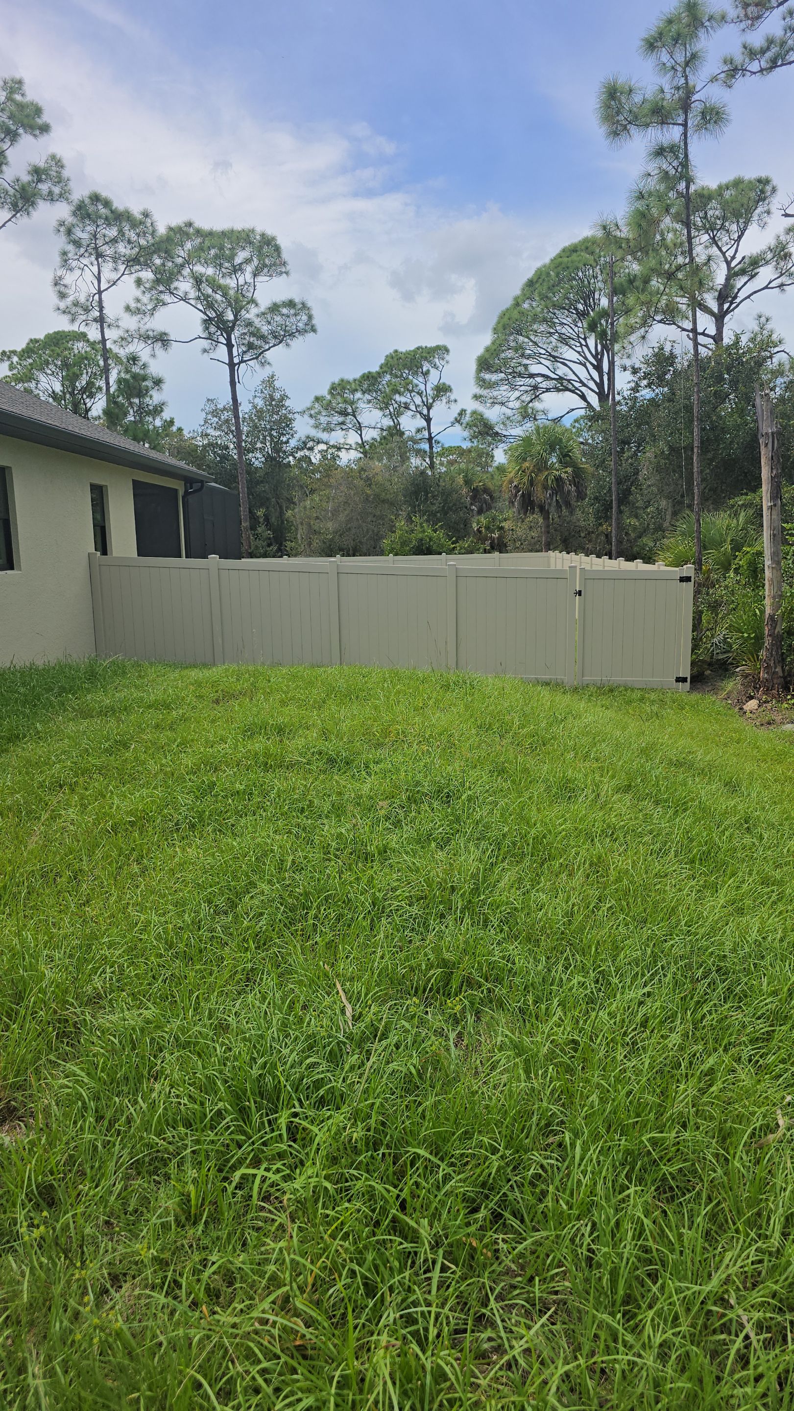 Tan Vinyl Privacy Fence and Gate Installation in Port Charlotte by True Fence LLC