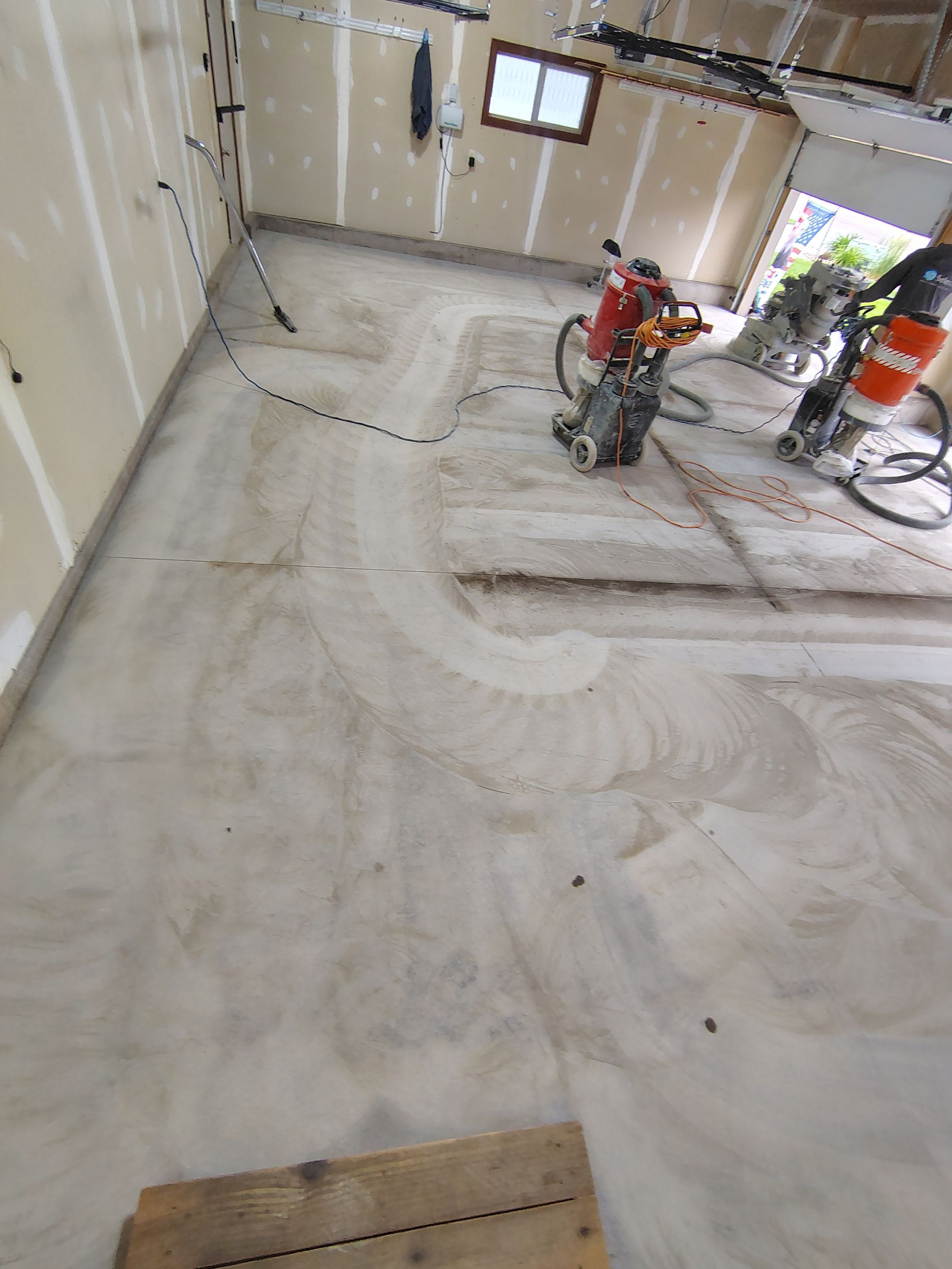 Multi-Car Garage Concrete Coating and Epoxy Finish in Sioux Falls by Select Painting, Coatings & Garage Cabinets