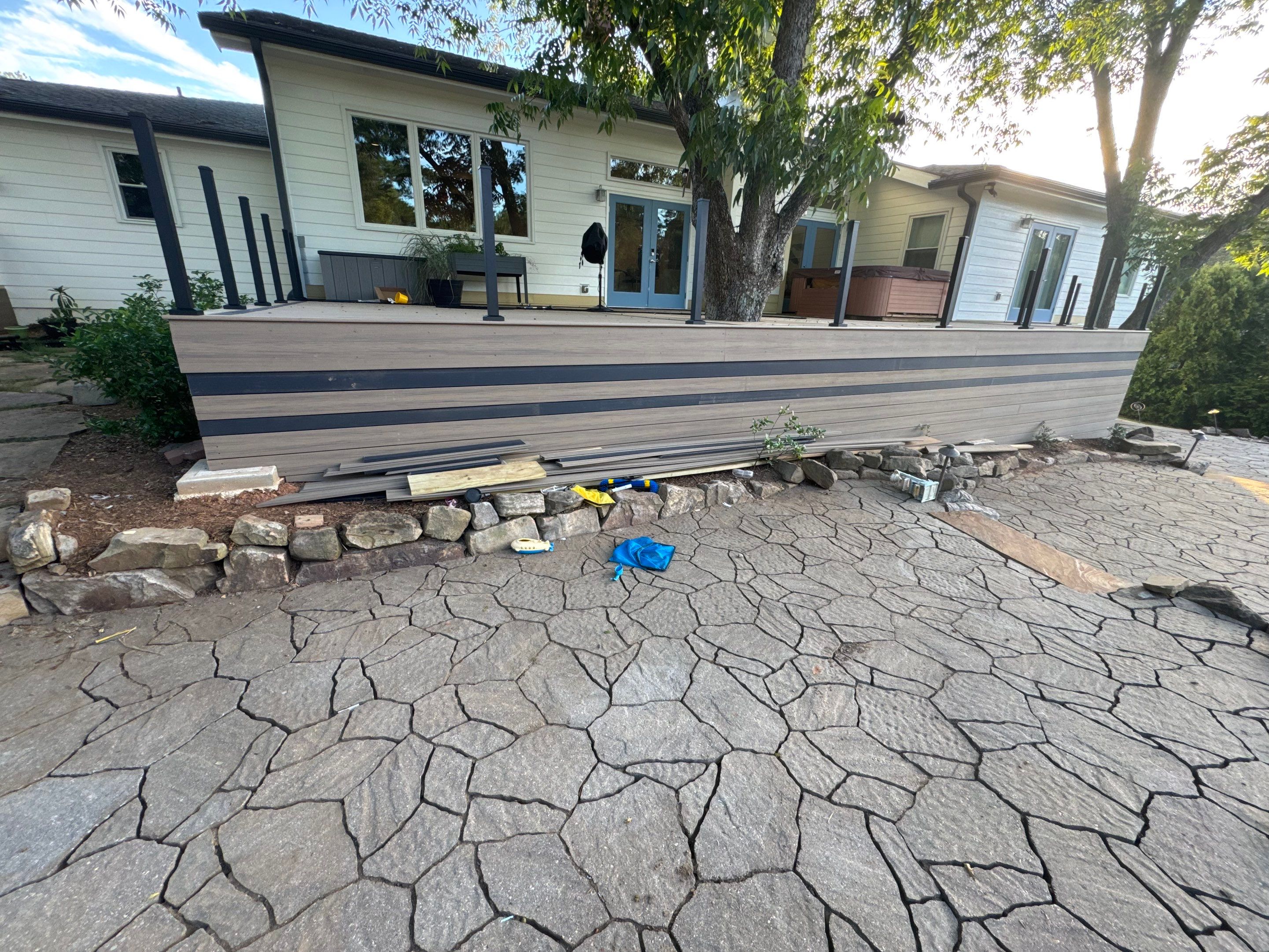 Deck Resurface with Glass Paneling and Deckorators Voyage Series Products by Nelson Exteriors 