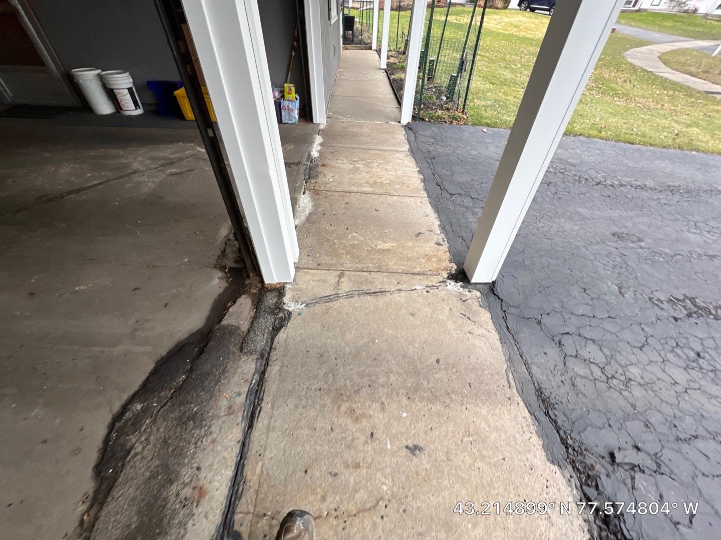 Concrete garage floor replacement with a broom finished apron and sidewalk  by NG Masonry & Construction LLC